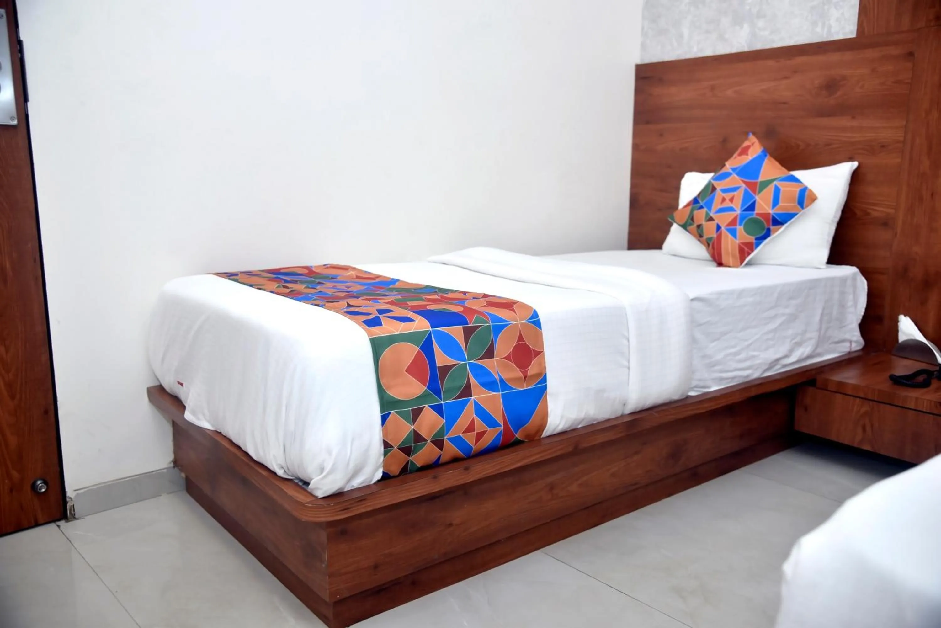 Bed in Hotel Pride Inn