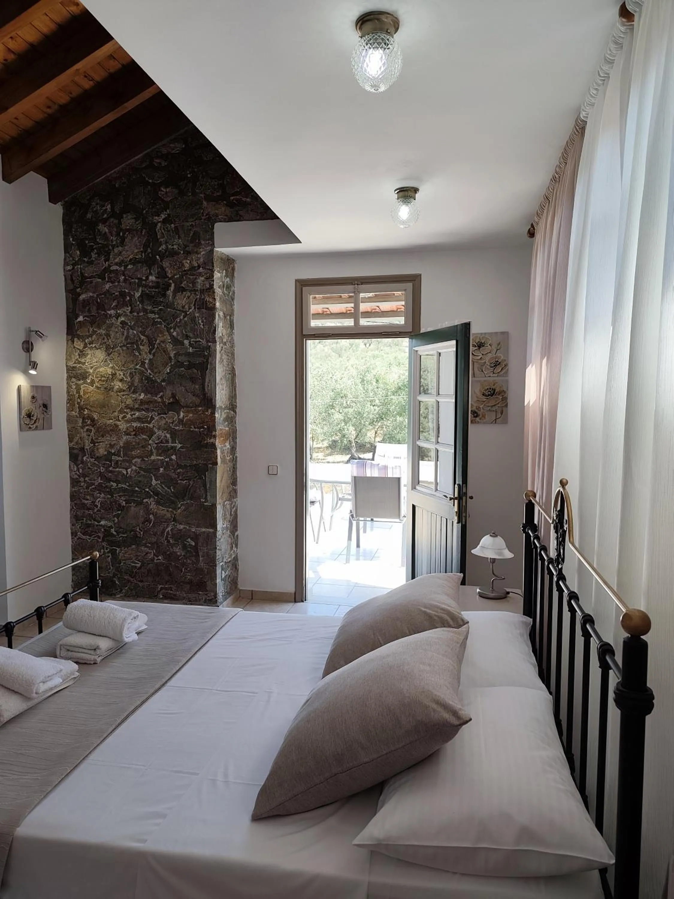 Property building, Bed in Elia Village by Irida Iris Group