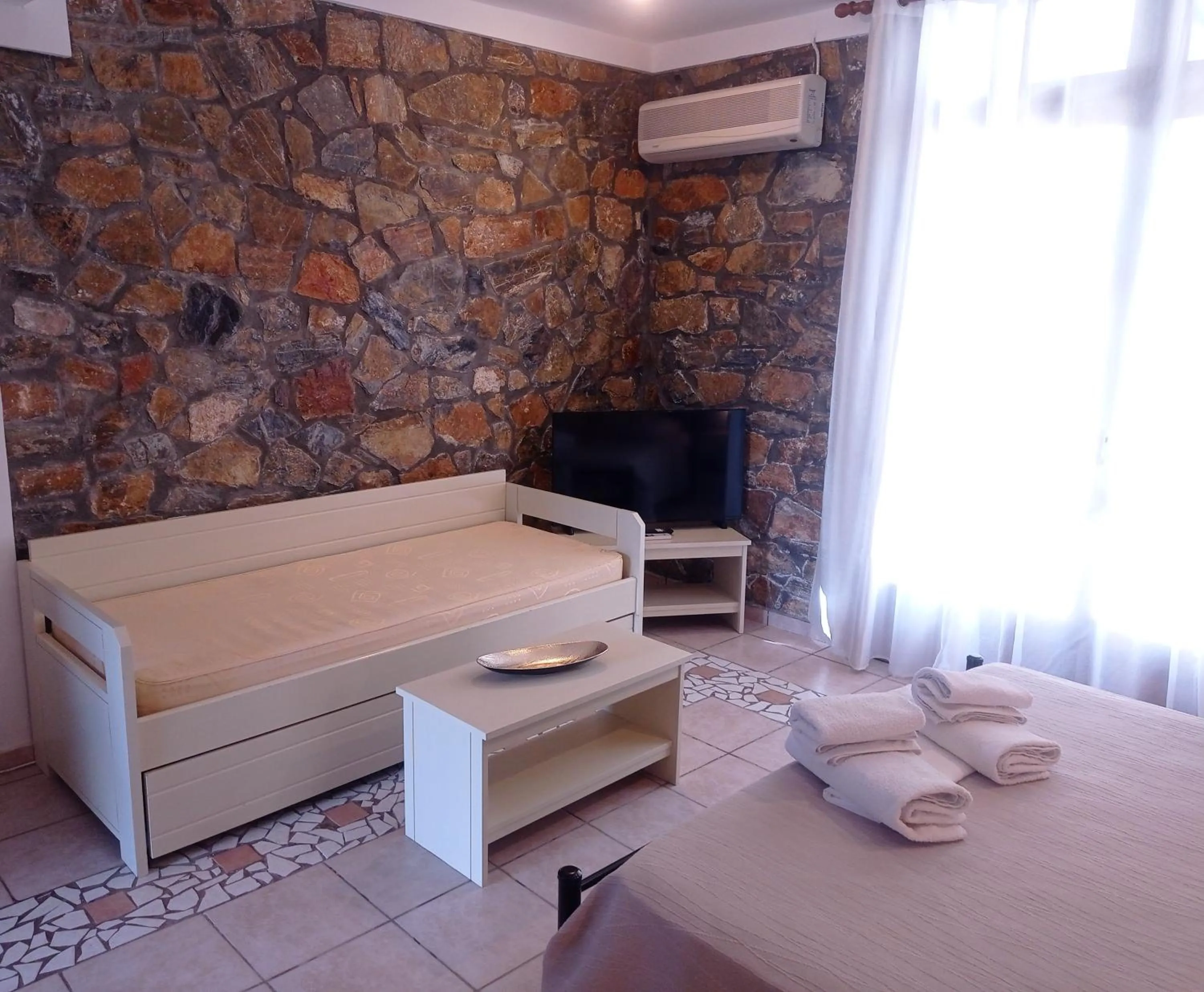 Bed in Elia Village by Irida Iris Group