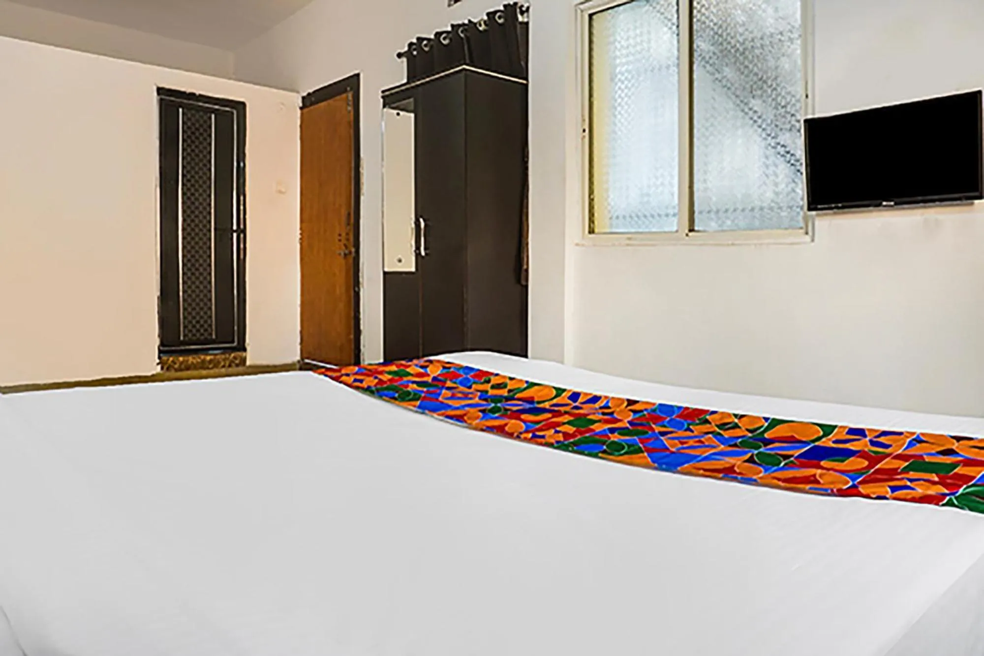 Bed in FabHotel Galaxy Airport Inn, Airport Road