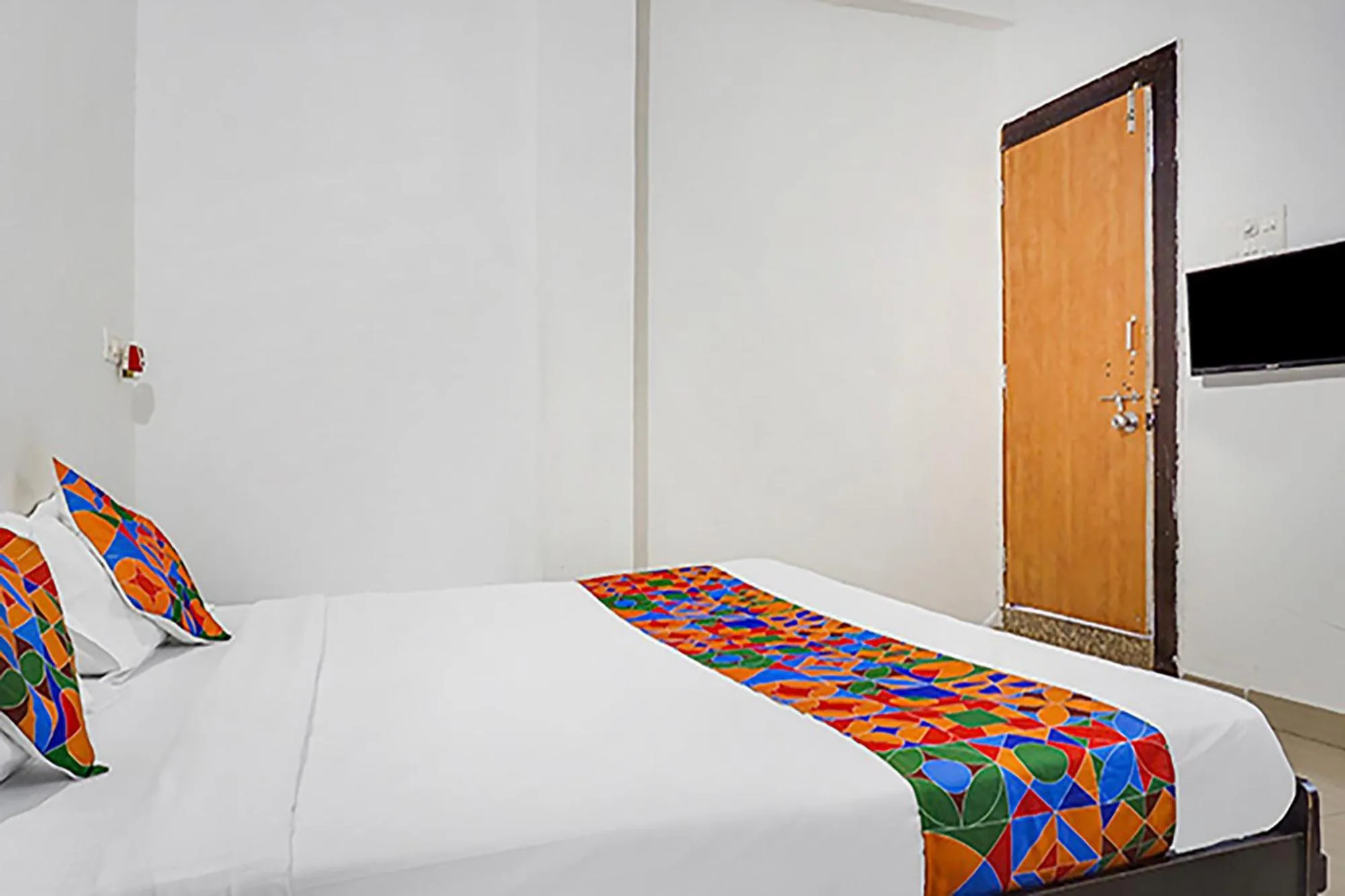 Bed in FabHotel Galaxy Airport Inn, Airport Road