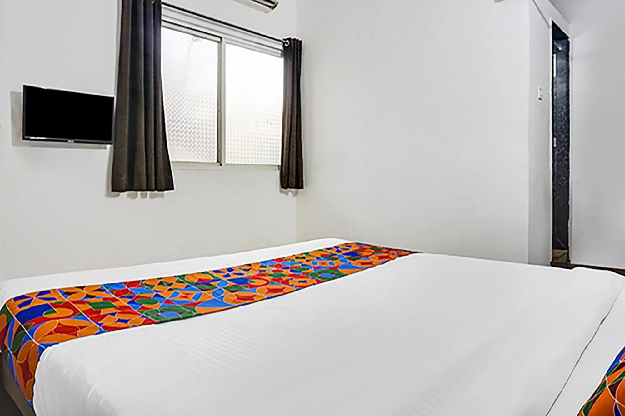 Bed in FabHotel Galaxy Airport Inn, Airport Road