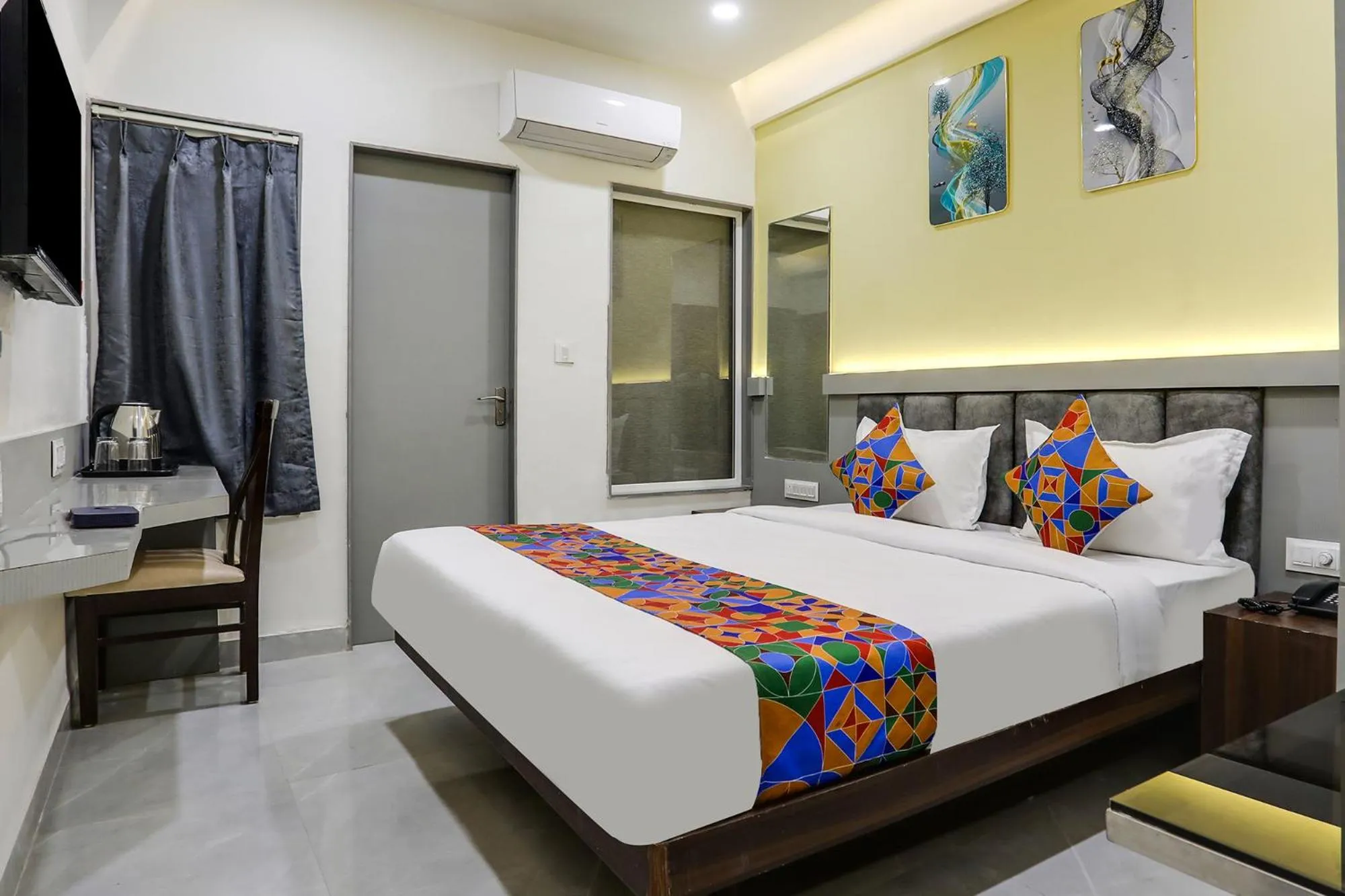 Bed in FabHotel Prime Panchwati Regency
