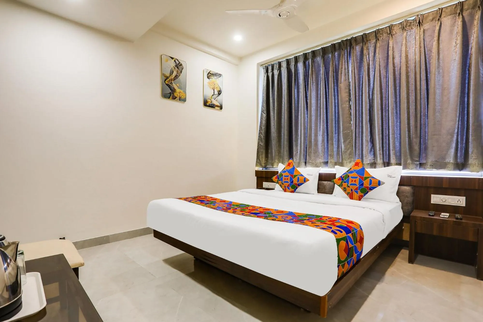 Bed in FabHotel Prime Panchwati Regency