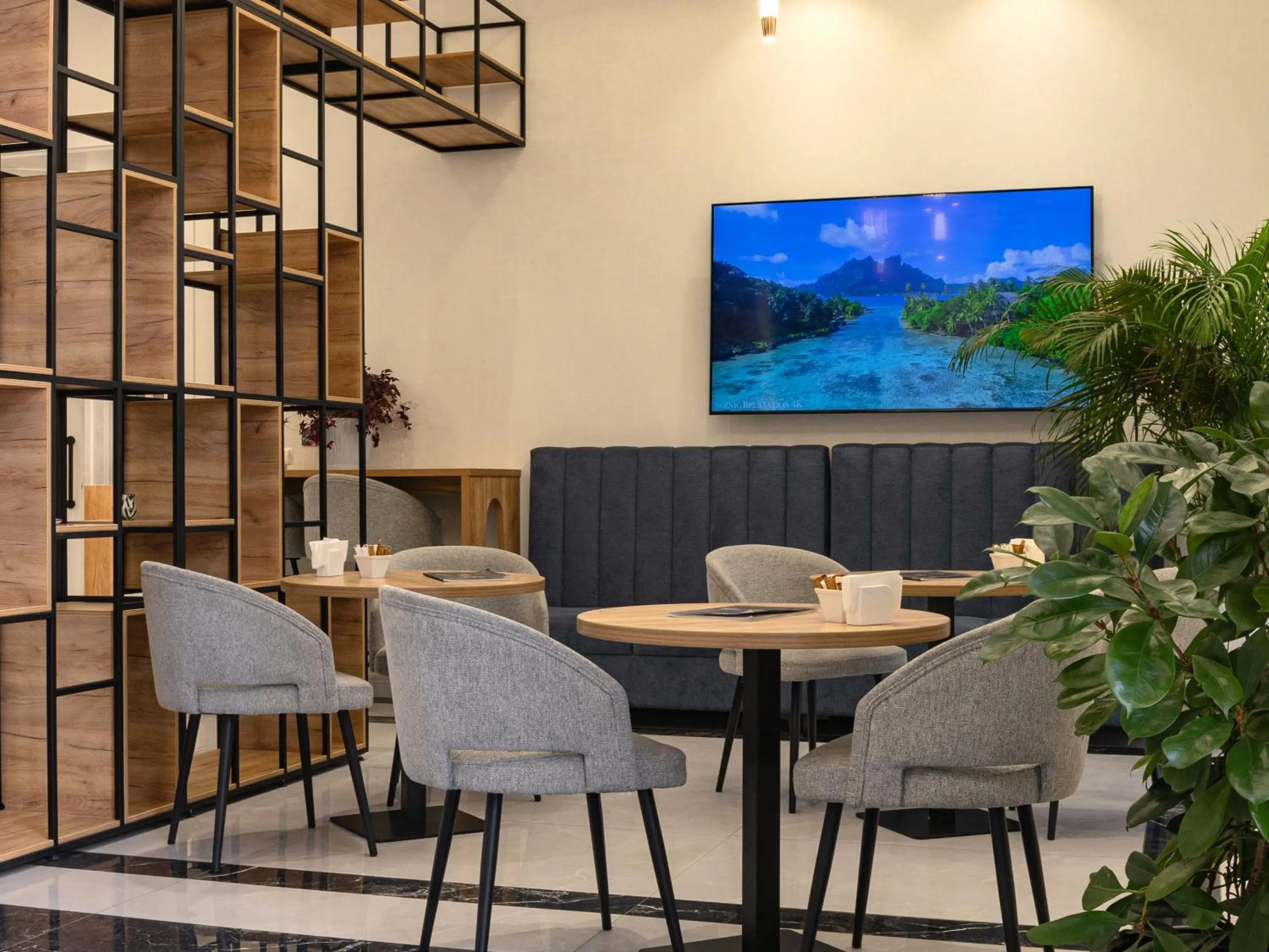 Communal lounge/ TV room in Baden-Baden Hotel Tashkent