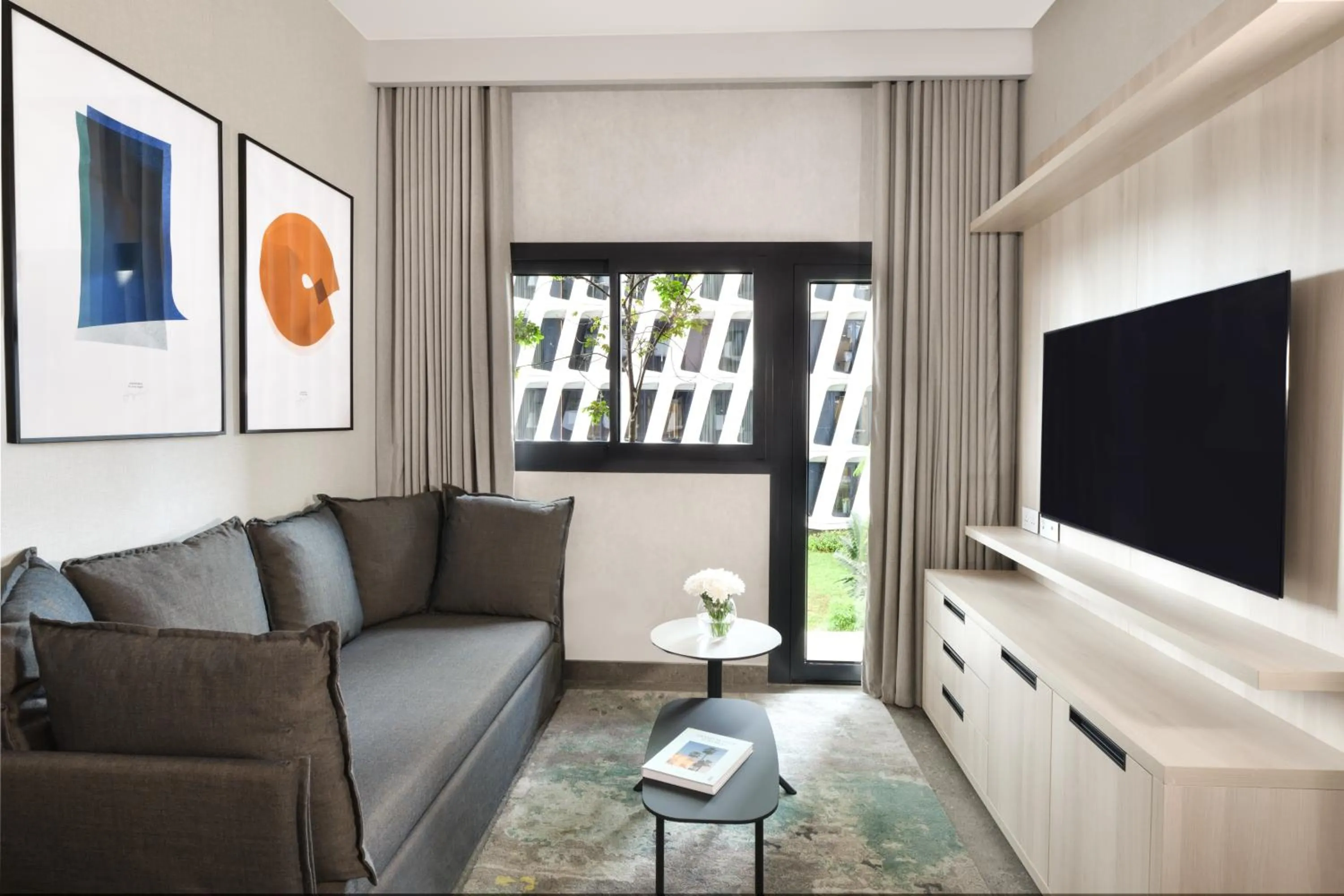 Communal lounge/ TV room in Aparthotel Adagio Abidjan Marcory