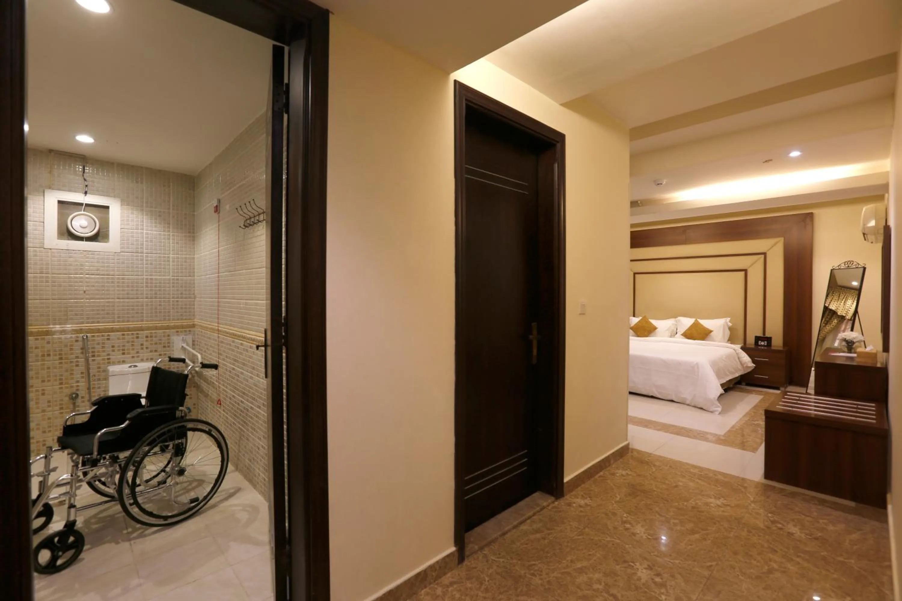 Facility for disabled guests, Bed in Hotelier Suites by Cantonal