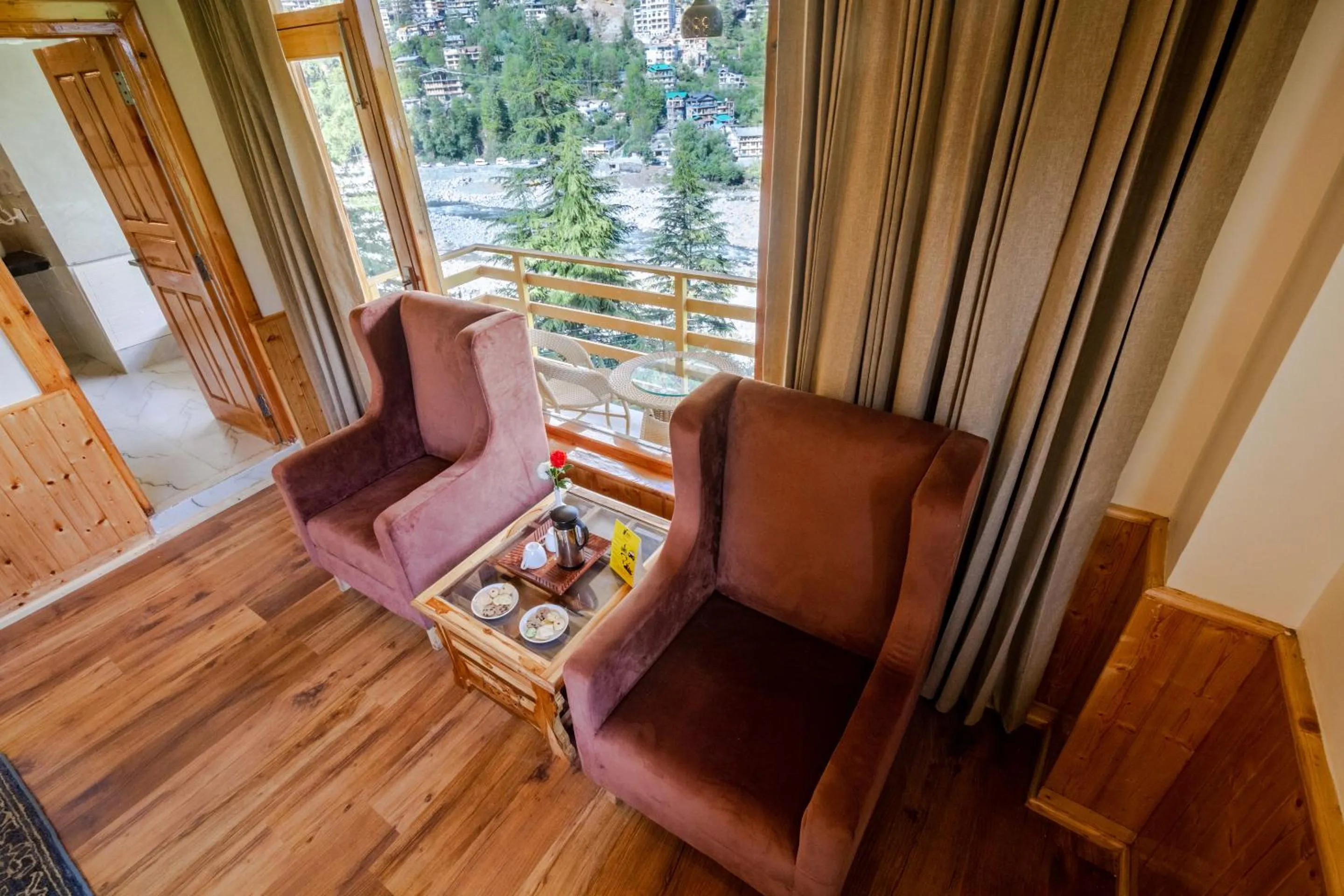 Seating area in Tripli Hotels Namaste Manali