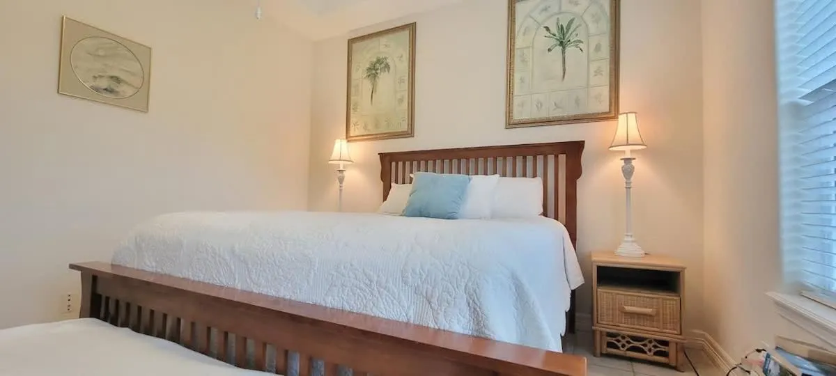 Bed in Beach & Palms condo