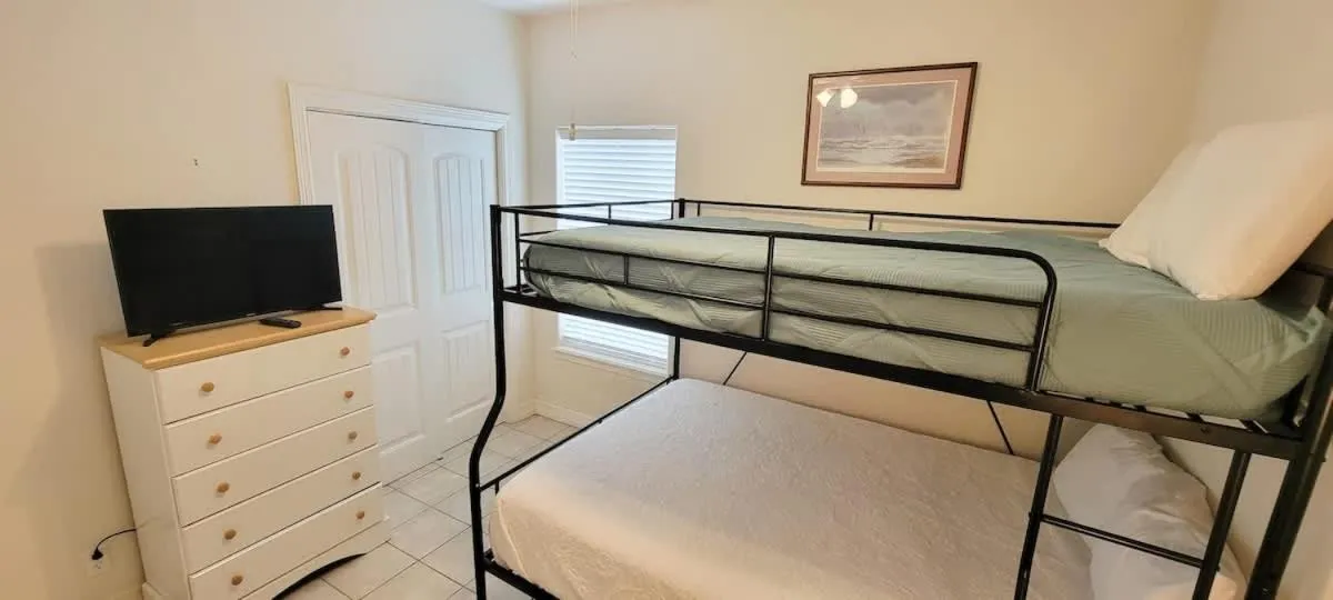 Bed in Beach & Palms condo