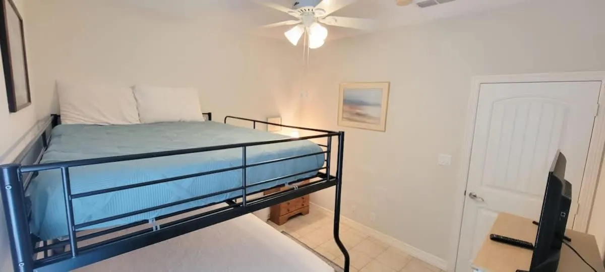 Bed in Beach & Palms condo