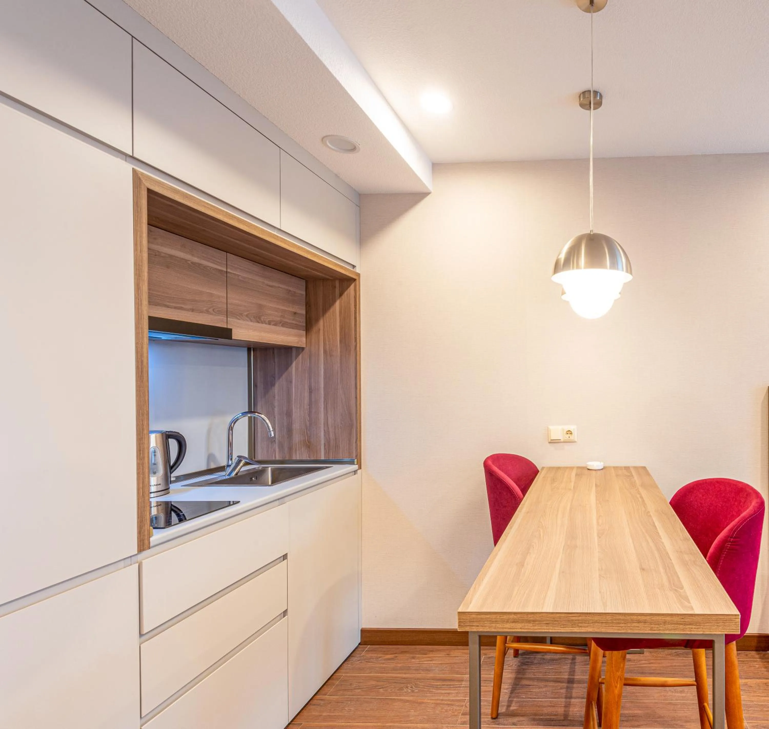 Kitchen or kitchenette in Sunshine Residence & Hotel