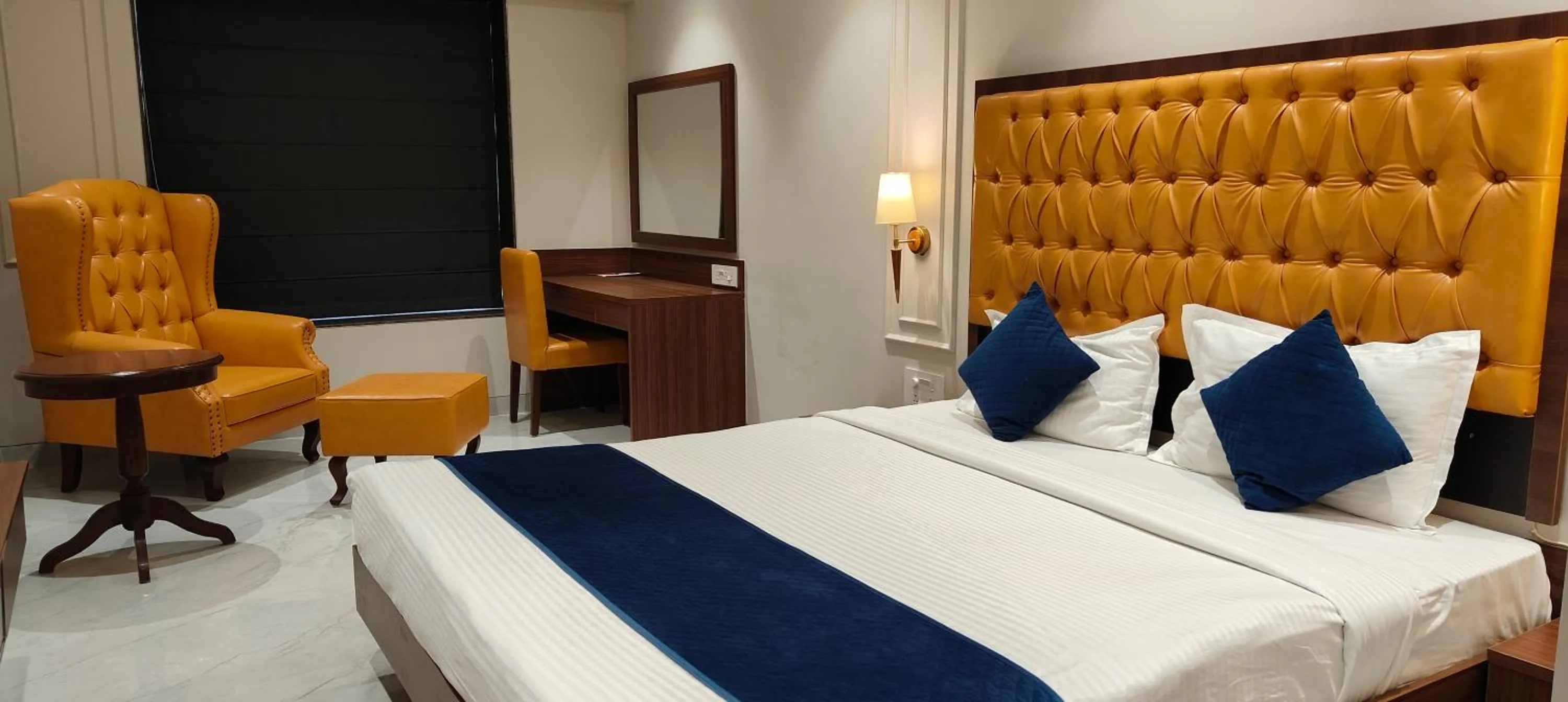 Seating area, Bed in Magnus Nexstar Suites Kalyani Nagar