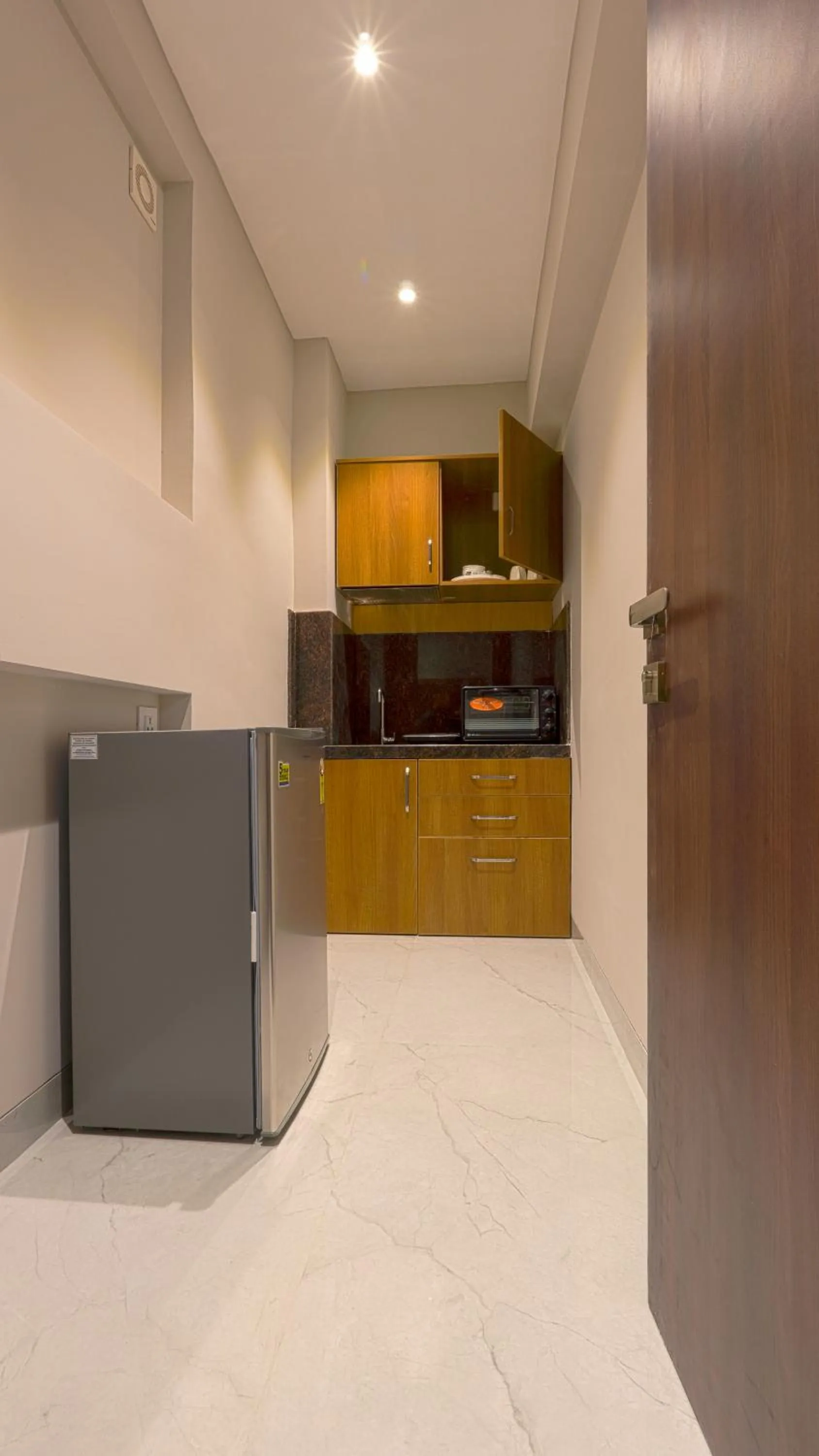 Kitchen or kitchenette in Magnus Nexstar Suites Kalyani Nagar