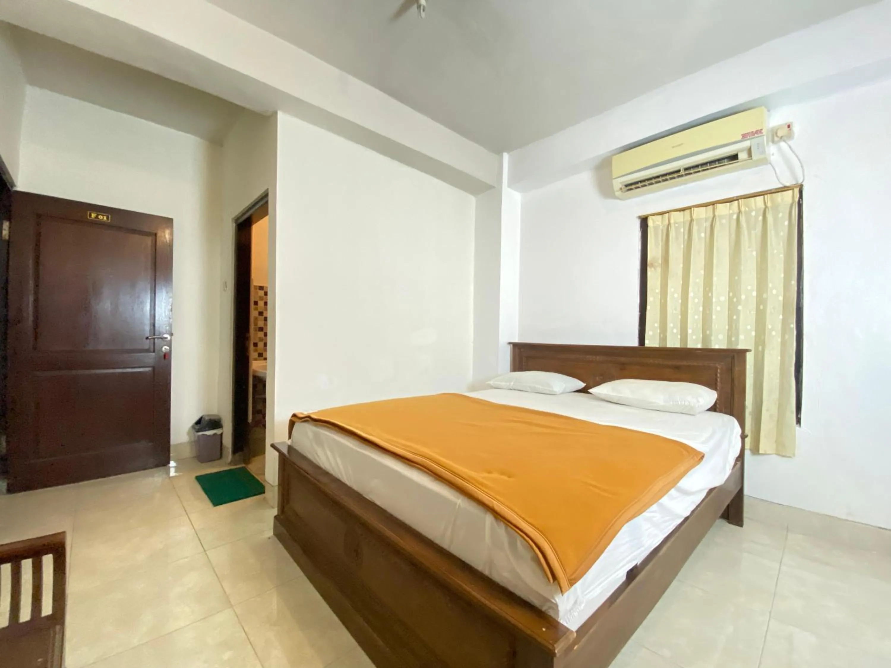 Bed in New Wijaya Hotel