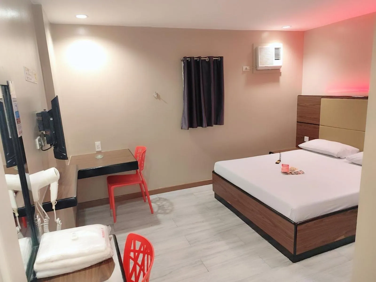 Photo of the whole room, Bed in Hotel Sogo Cagayan De Oro