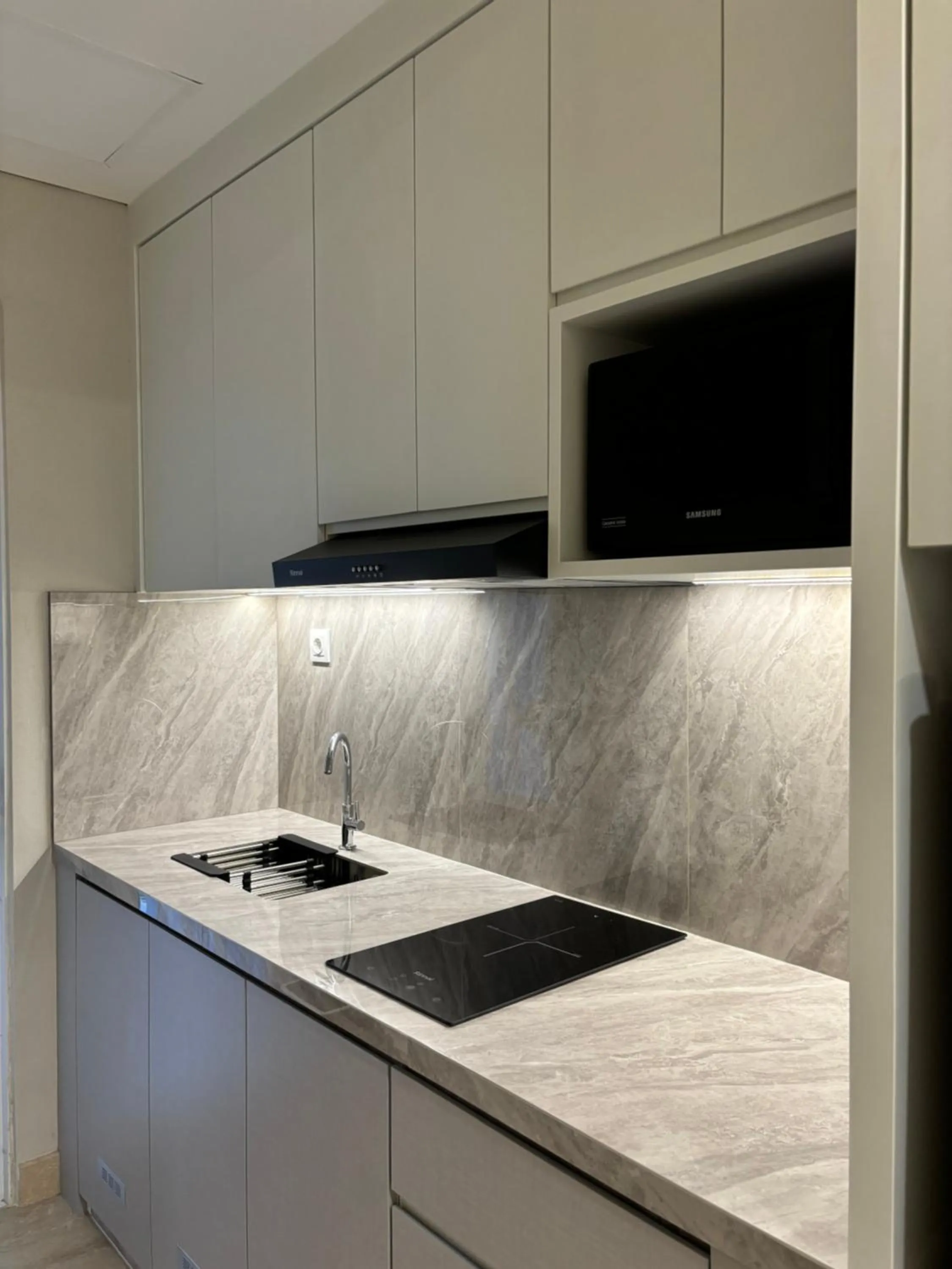 Kitchen or kitchenette in Apartment Podomoro Medan