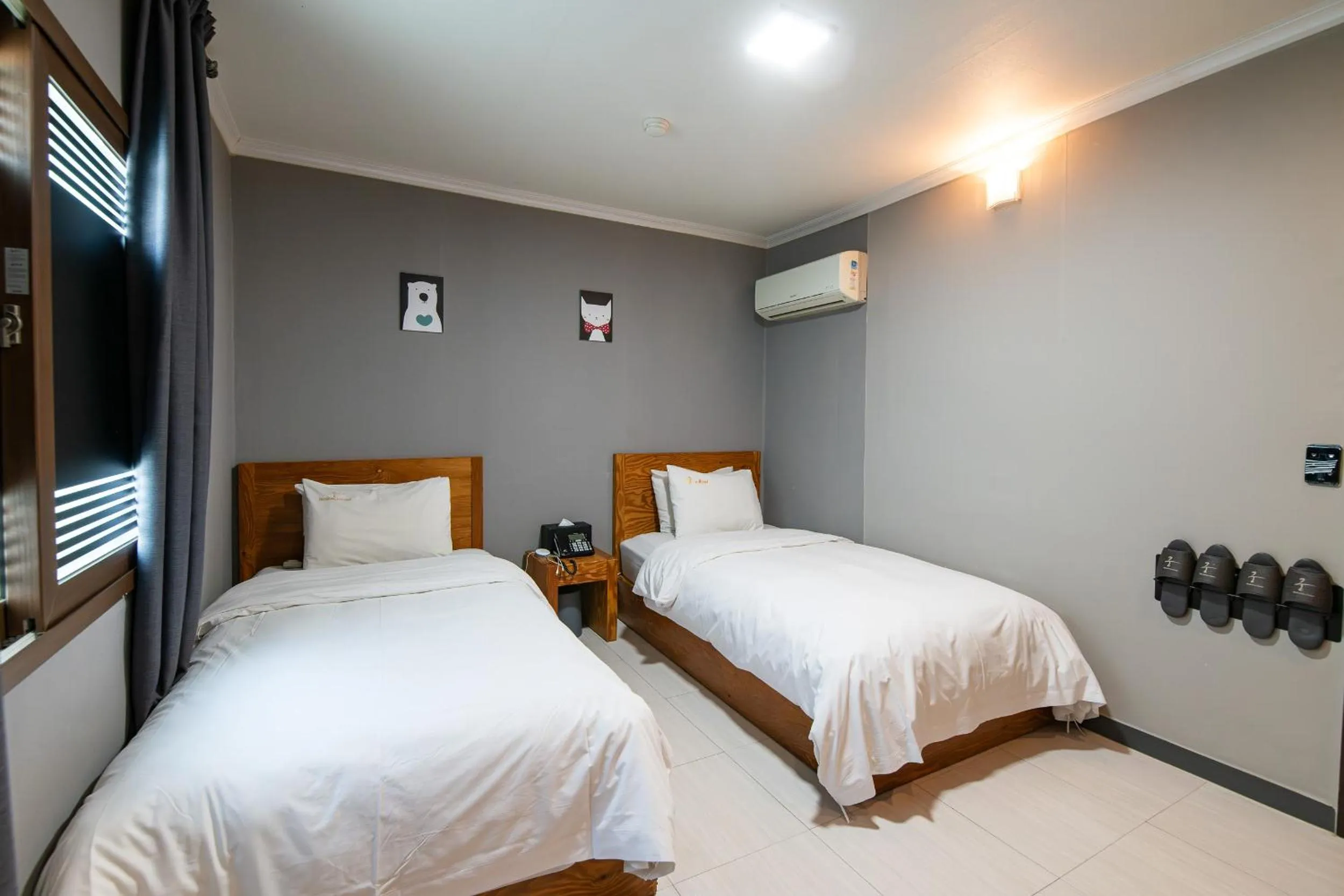 Bed in Gung Business Hotel