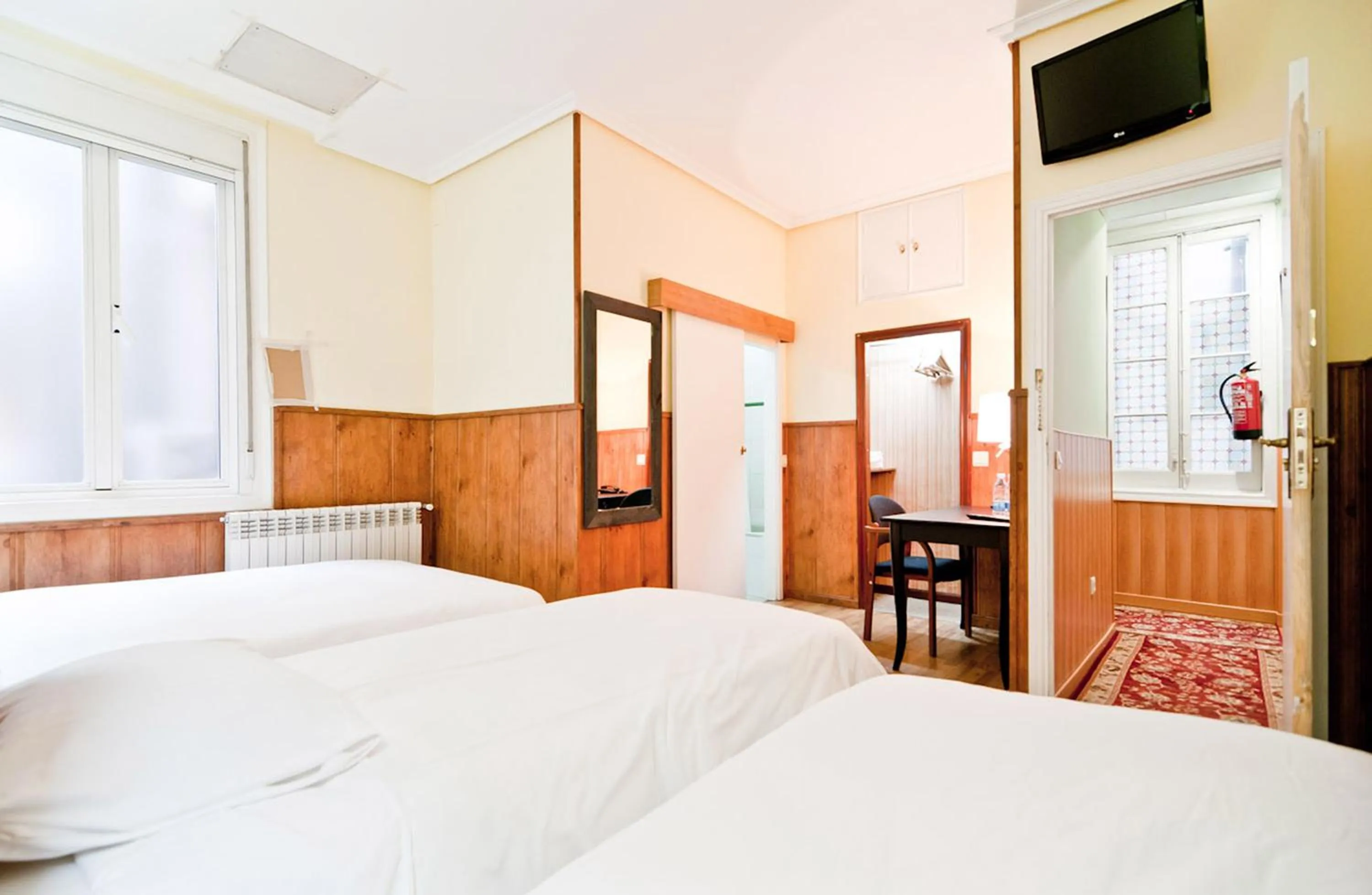 Photo of the whole room, Bed in Hostal Asunción