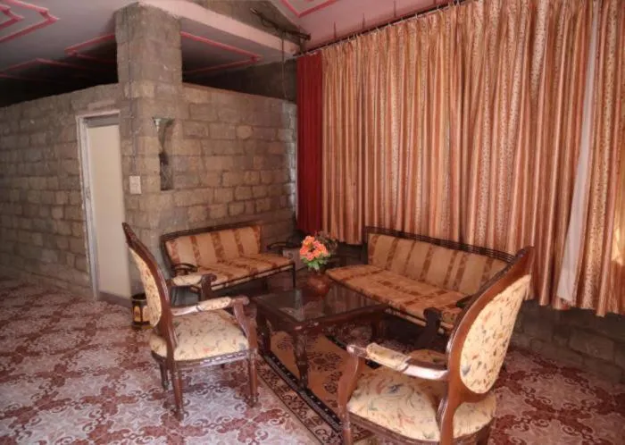 Living room in PRITHVI FARM COTTAGE AND VILLA