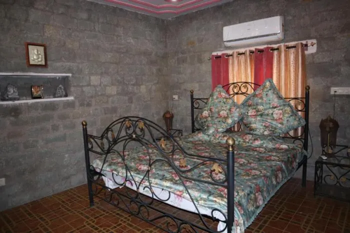 Bed in PRITHVI FARM COTTAGE AND VILLA