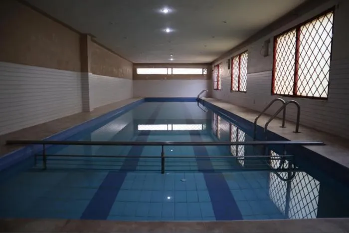 Swimming pool in PRITHVI FARM COTTAGE AND VILLA