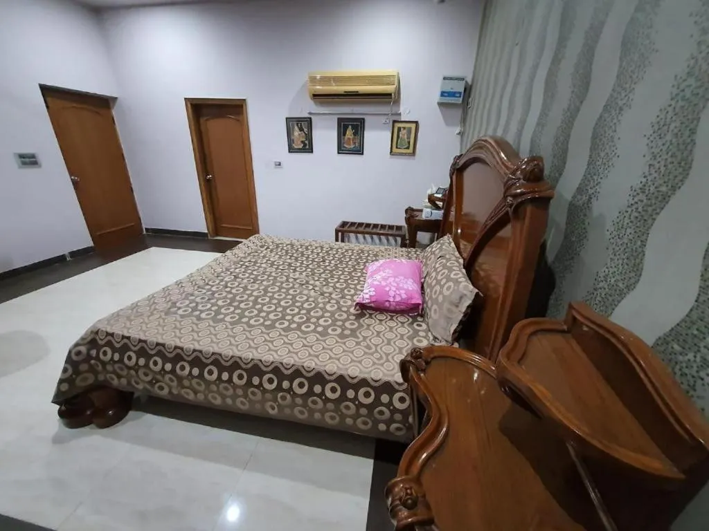 Bed in PRITHVI FARM COTTAGE AND VILLA