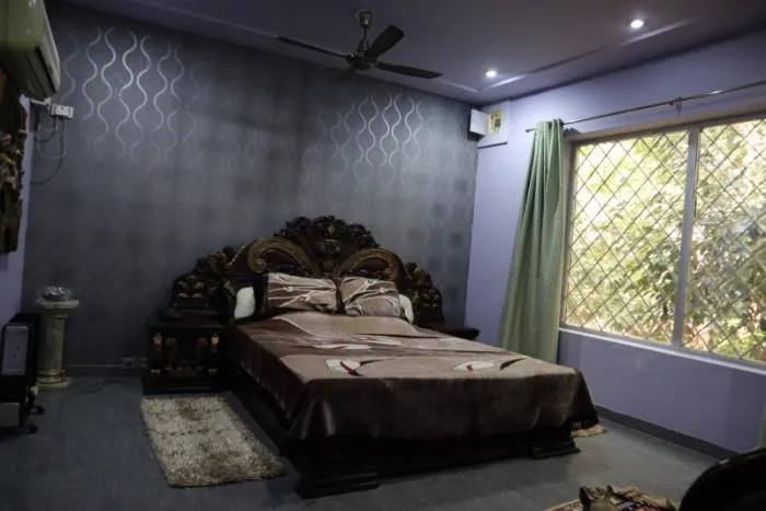 Bed in PRITHVI FARM COTTAGE AND VILLA