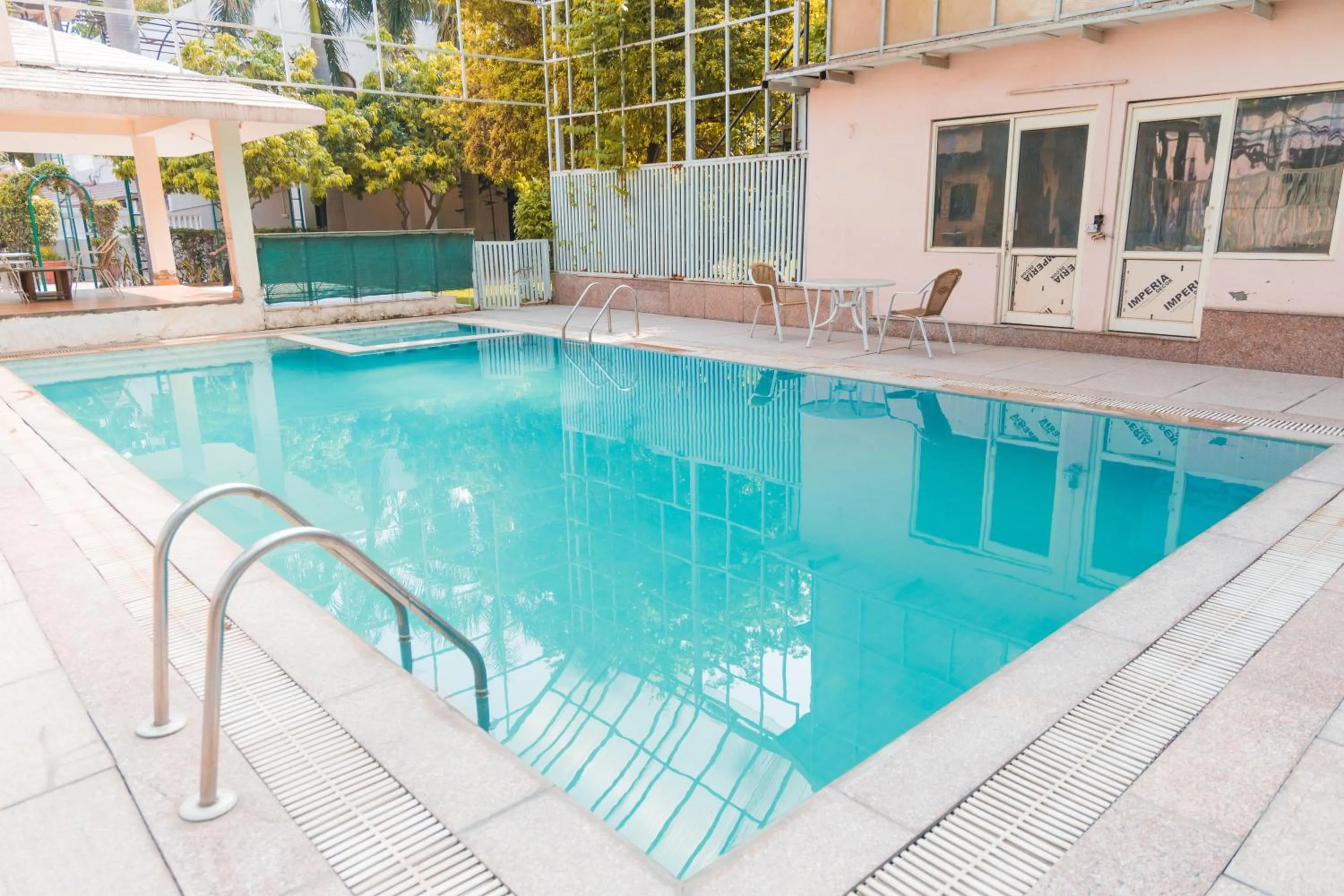 Swimming pool in The Nikunj Hotels