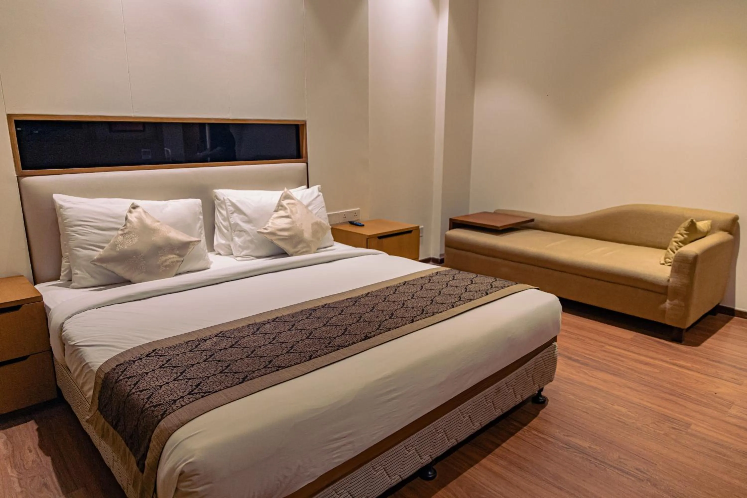 Bed in The Nikunj Hotels