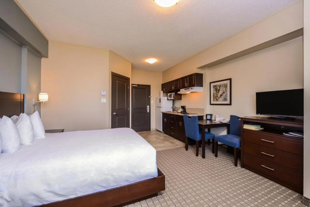 Bed in Kindersley All Suites Hotel