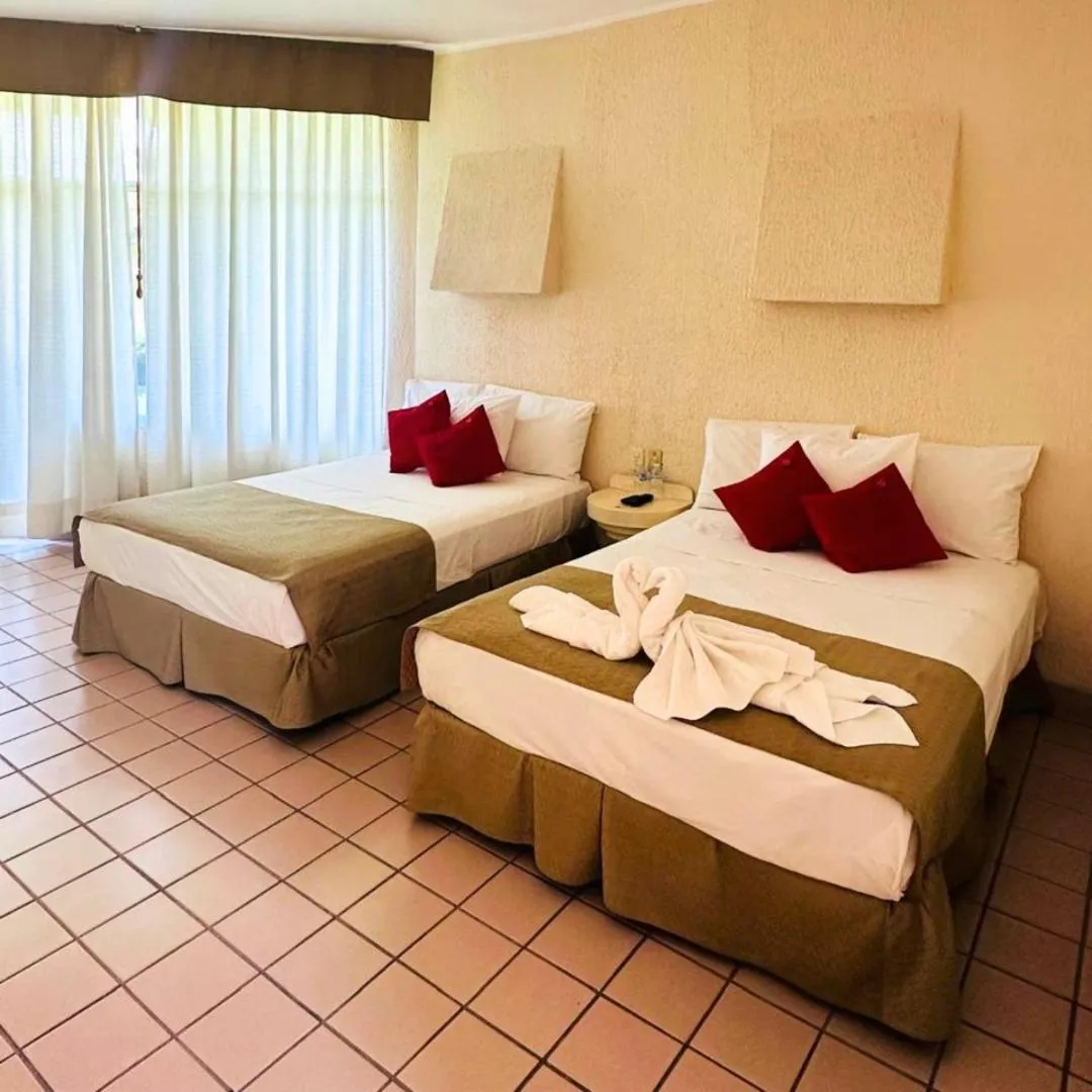 Bed in Hotel Hacienda del Rio Oaxtepec