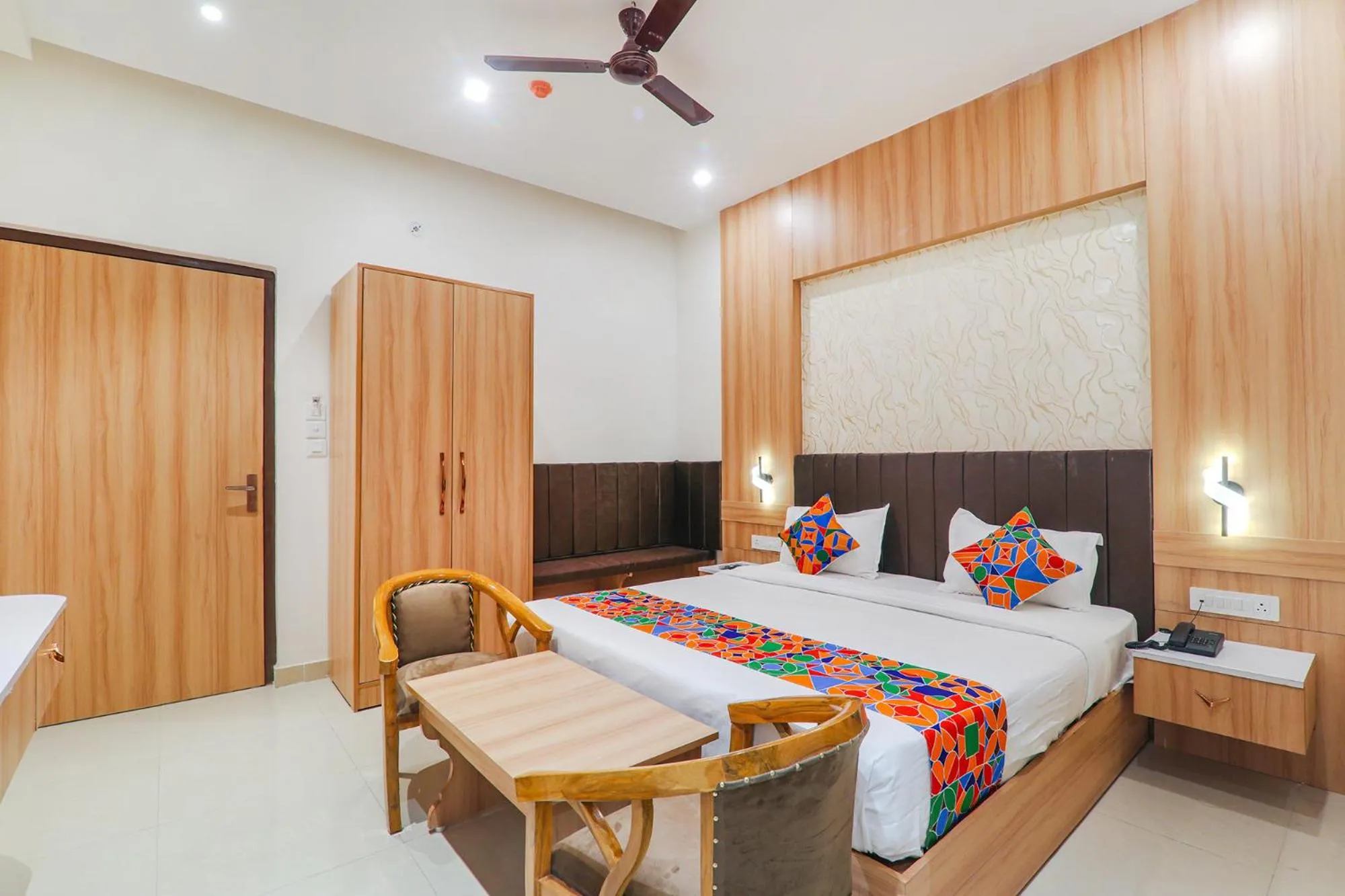 Bed in FabHotel Raj Palace