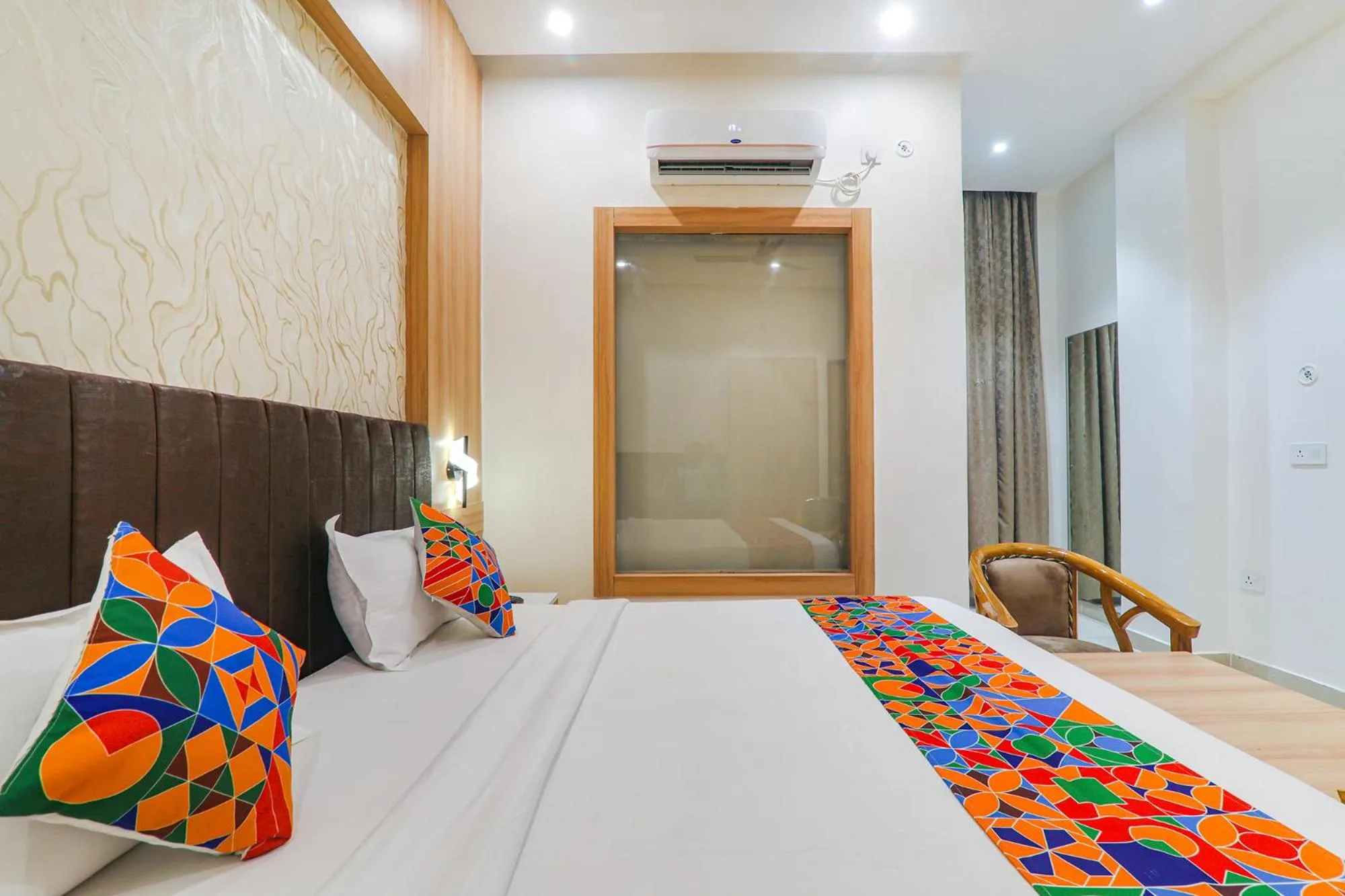 Bed in FabHotel Raj Palace