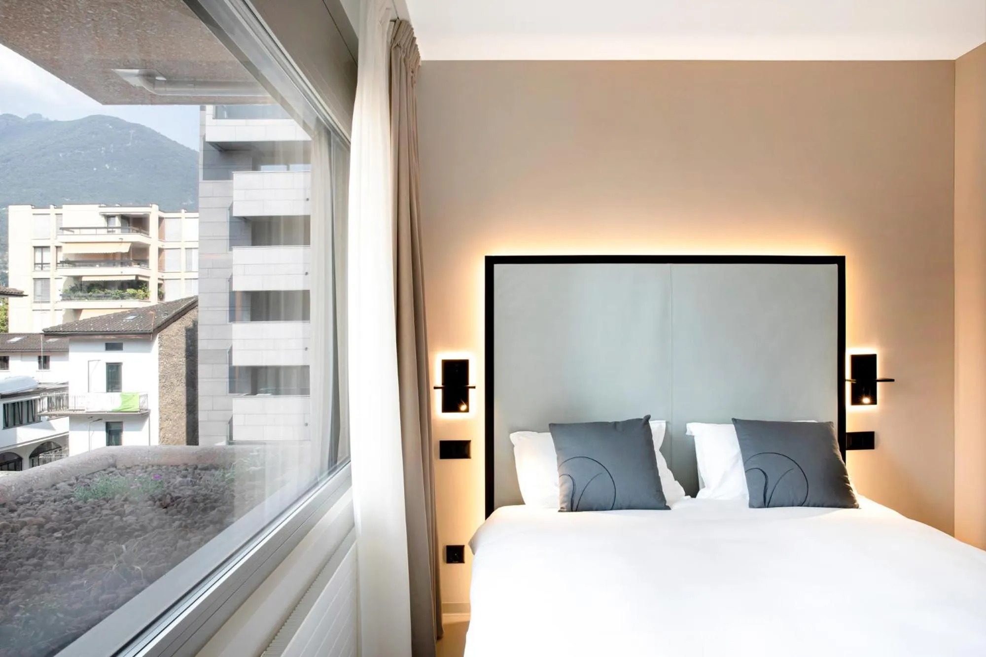 Bed in VISIONAPARTMENTS Lugano - contactless check-in