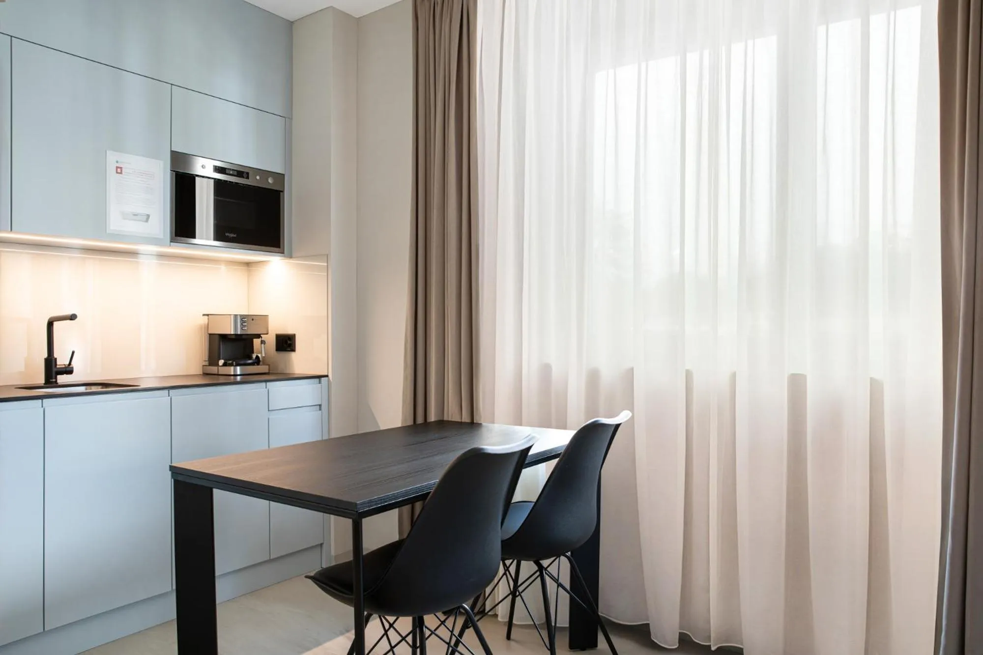 Dining area in VISIONAPARTMENTS Lugano - contactless check-in