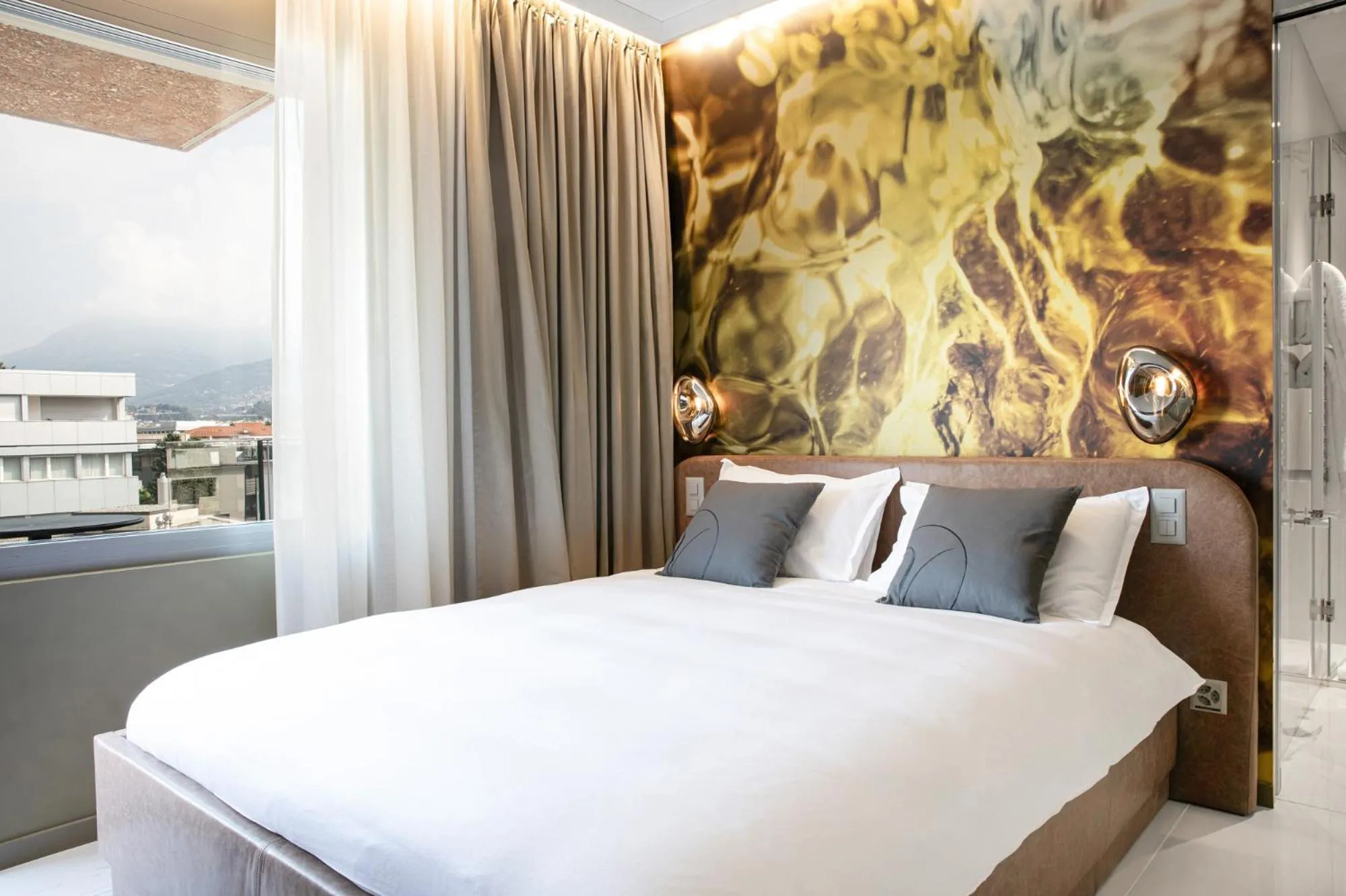 Bed in VISIONAPARTMENTS Lugano - contactless check-in