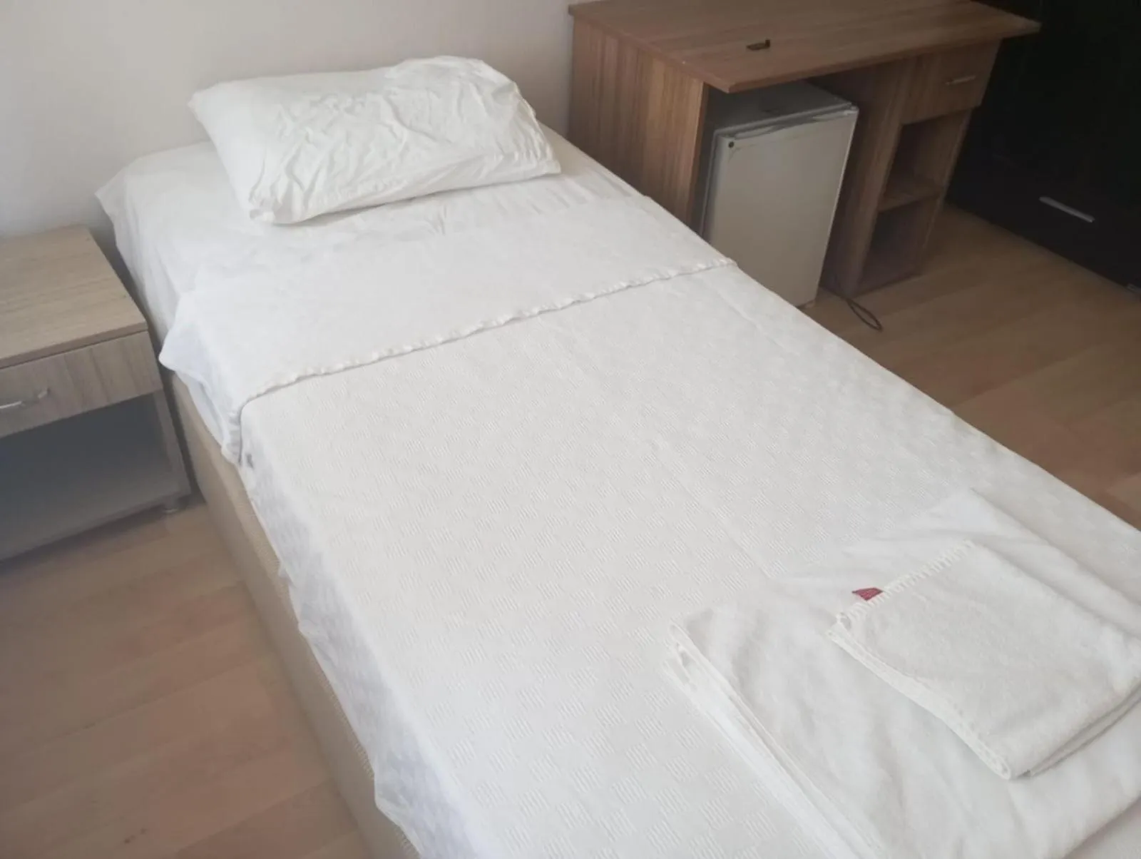 Bed in Kalanora Resort Hotel