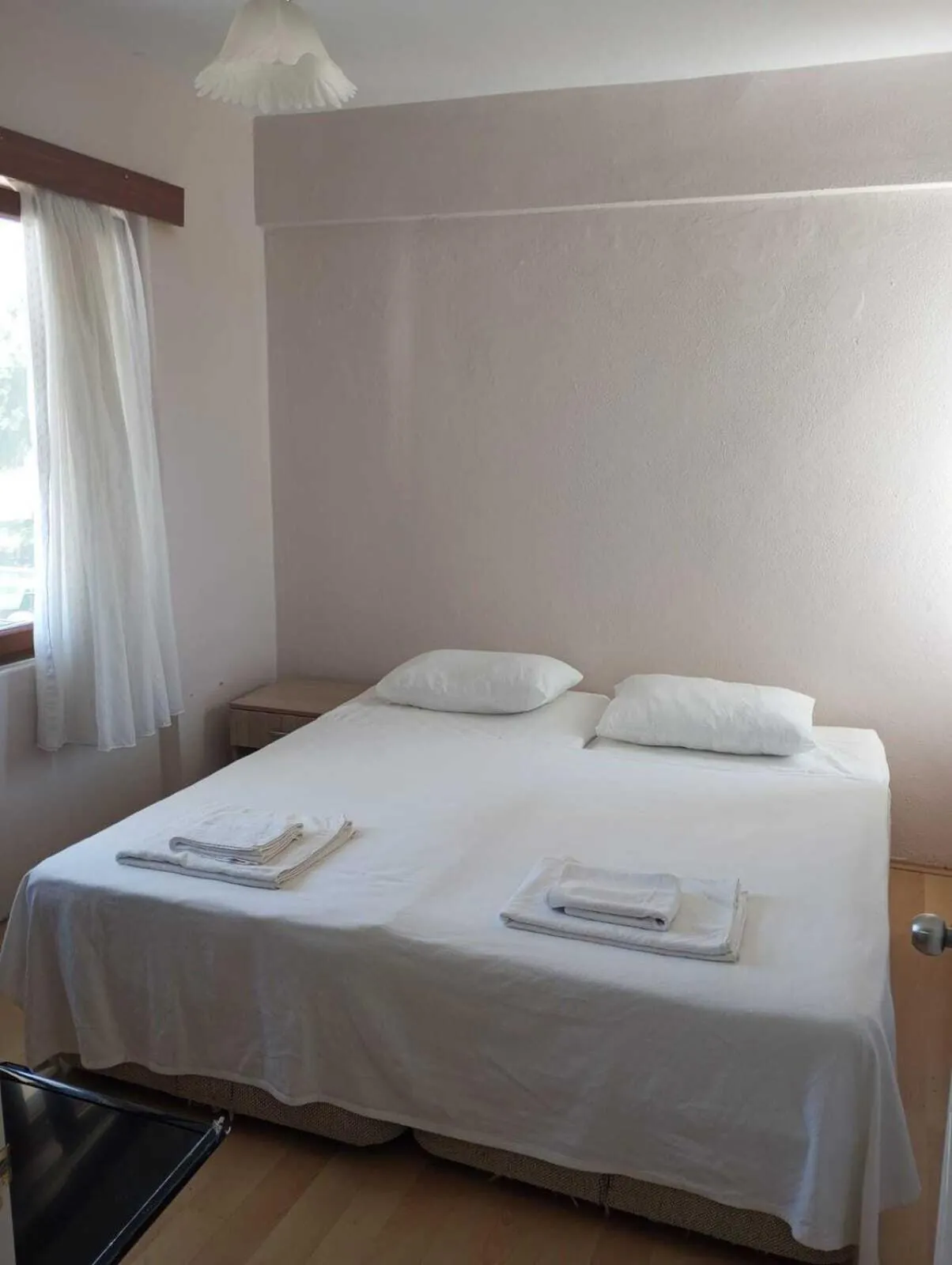 Bed in Kalanora Resort Hotel