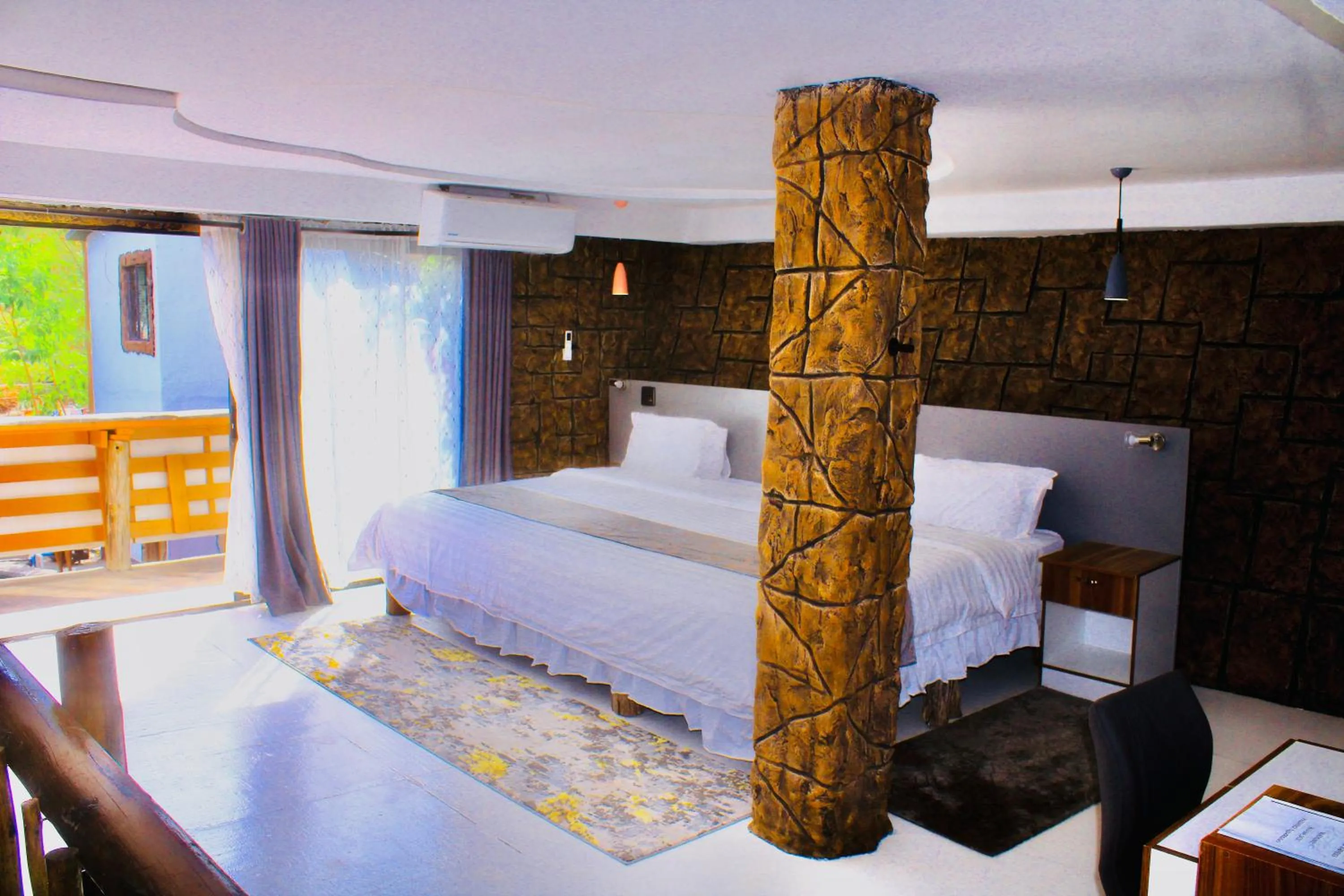 Bed in Rustiek Hotel