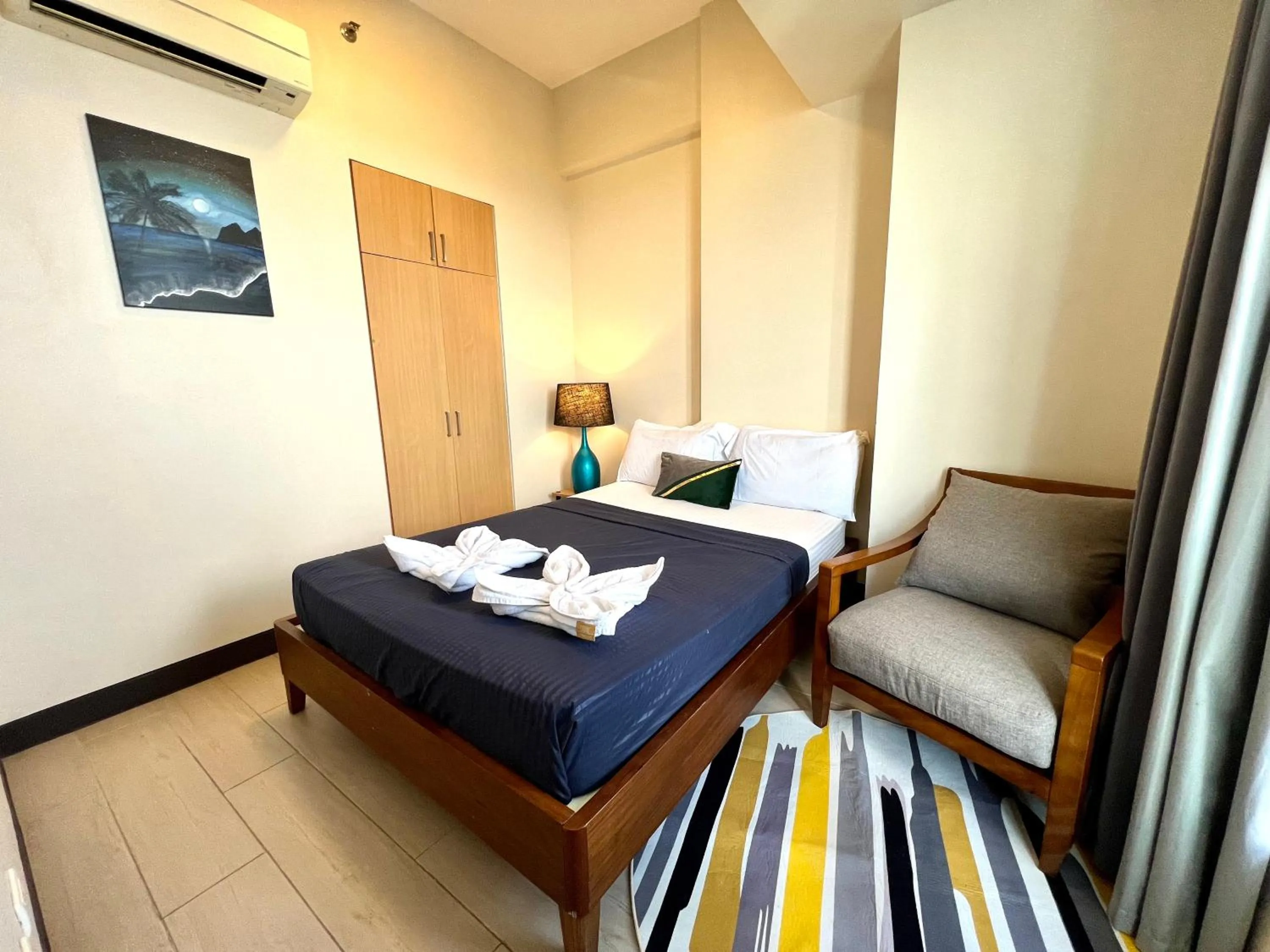 Bed in Mactan Newtown A by Isla Stays