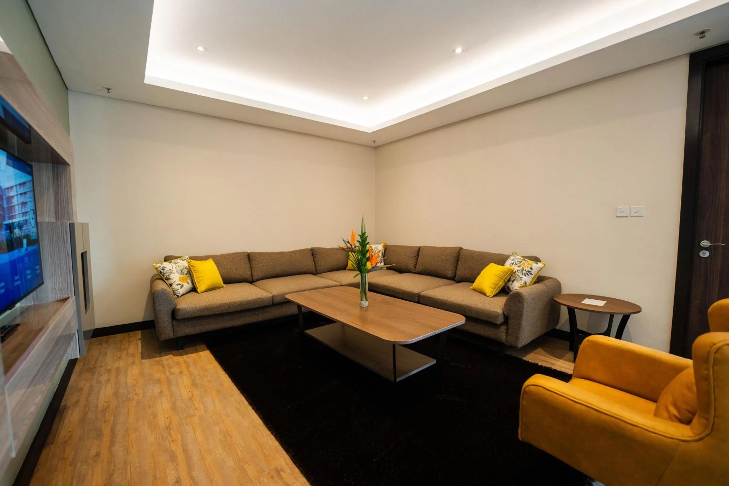 Living room in Trademark Suites at Enaki Town