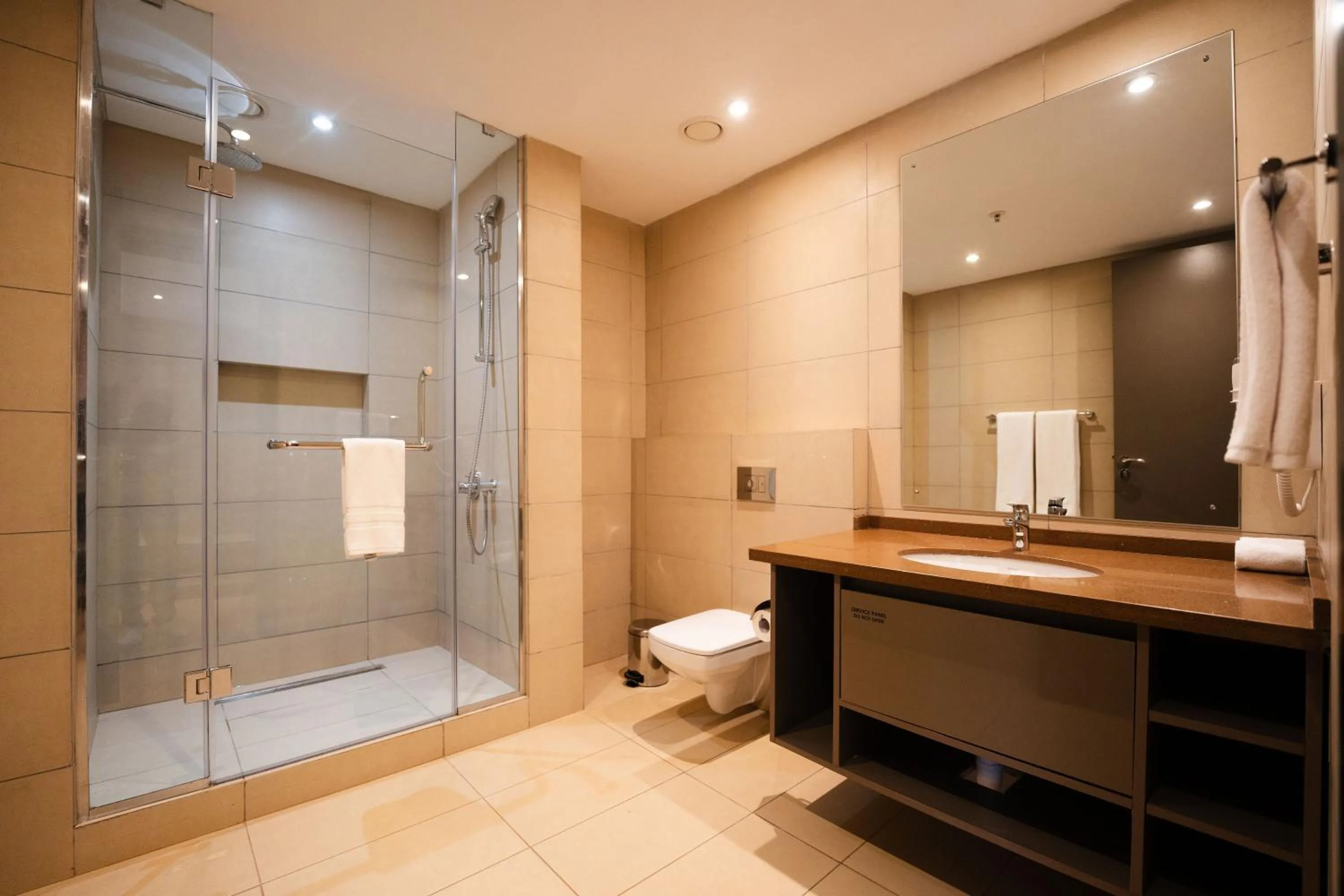 Bathroom in Trademark Suites at Enaki Town