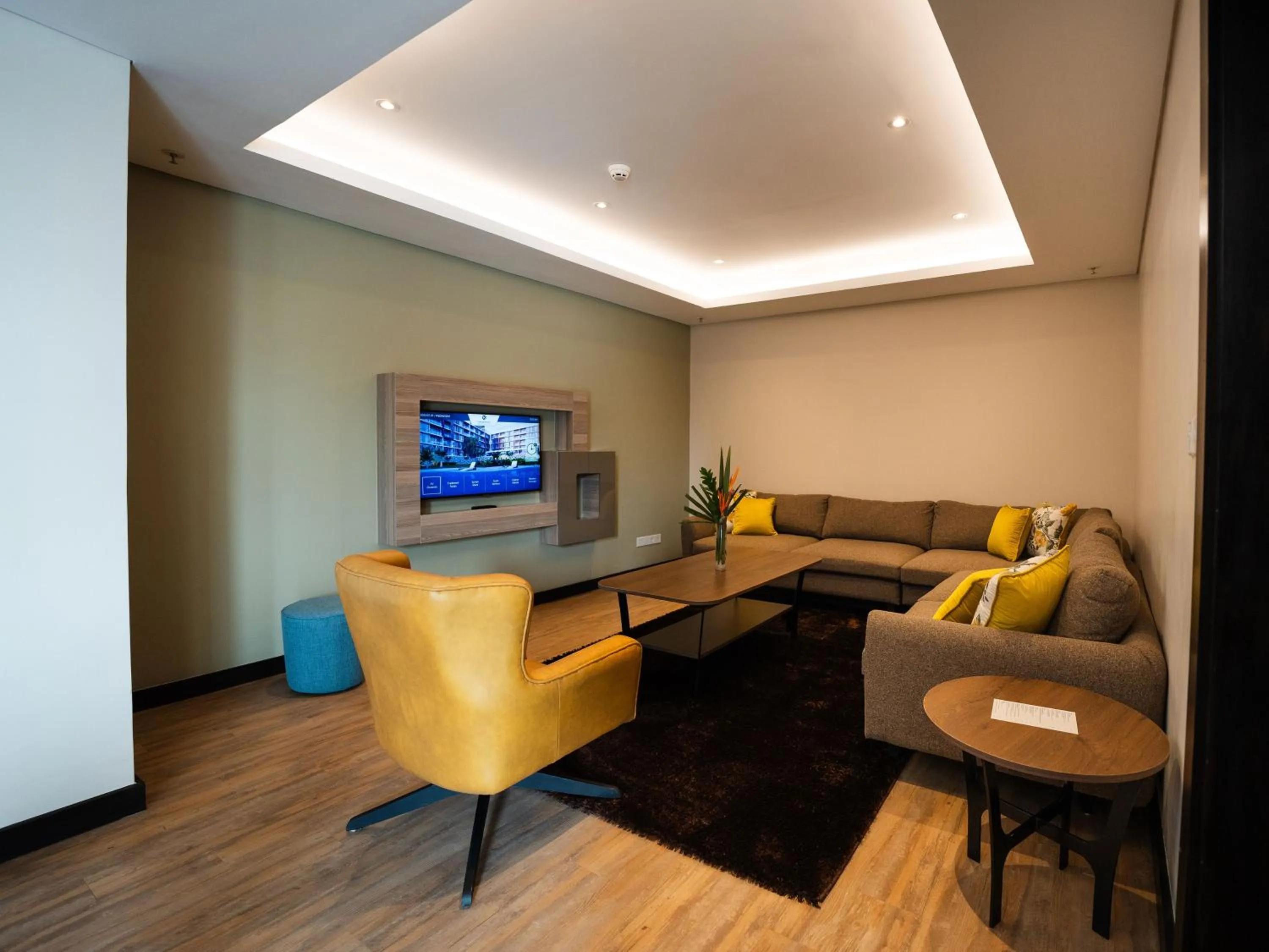 Living room in Trademark Suites at Enaki Town