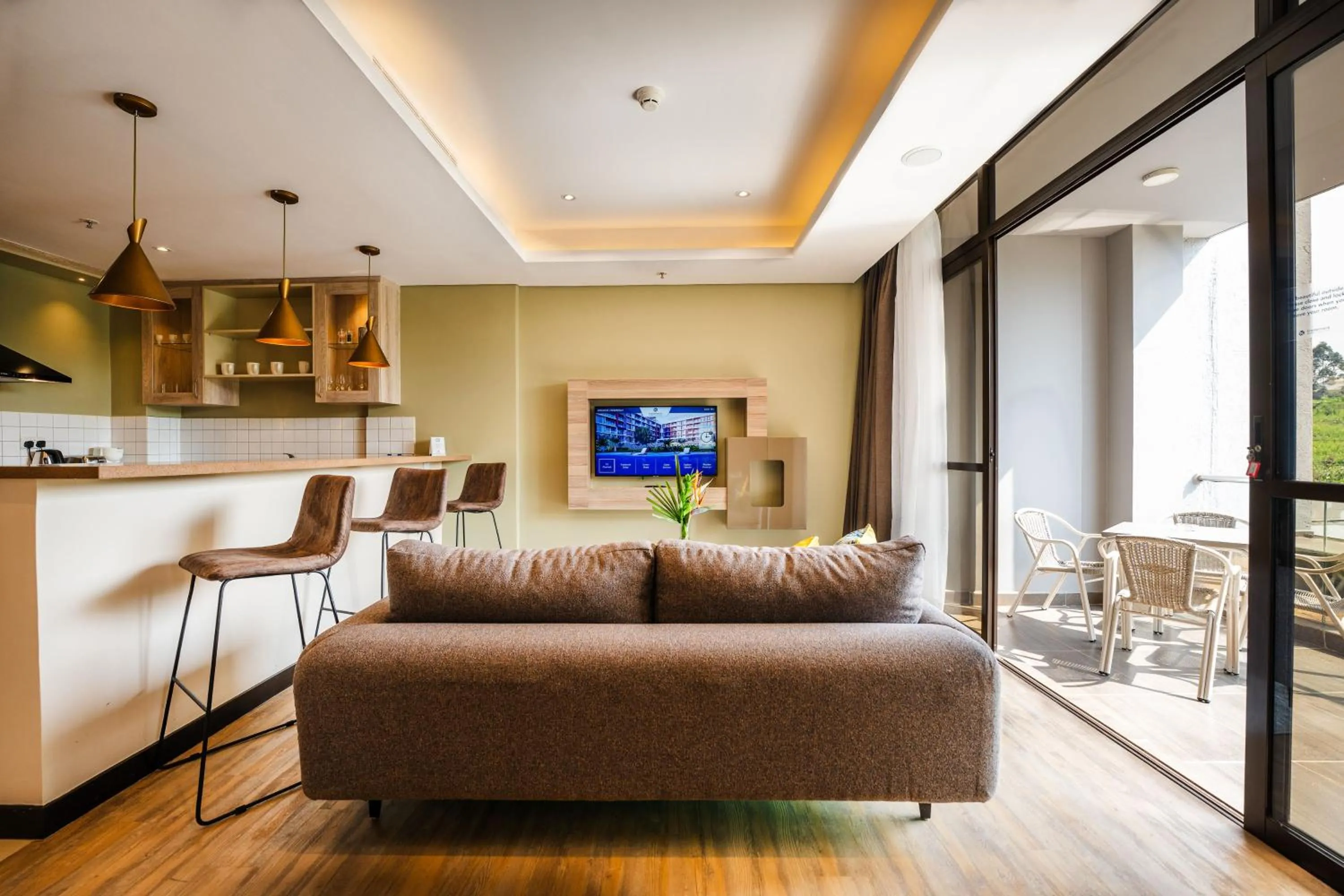 Living room in Trademark Suites at Enaki Town