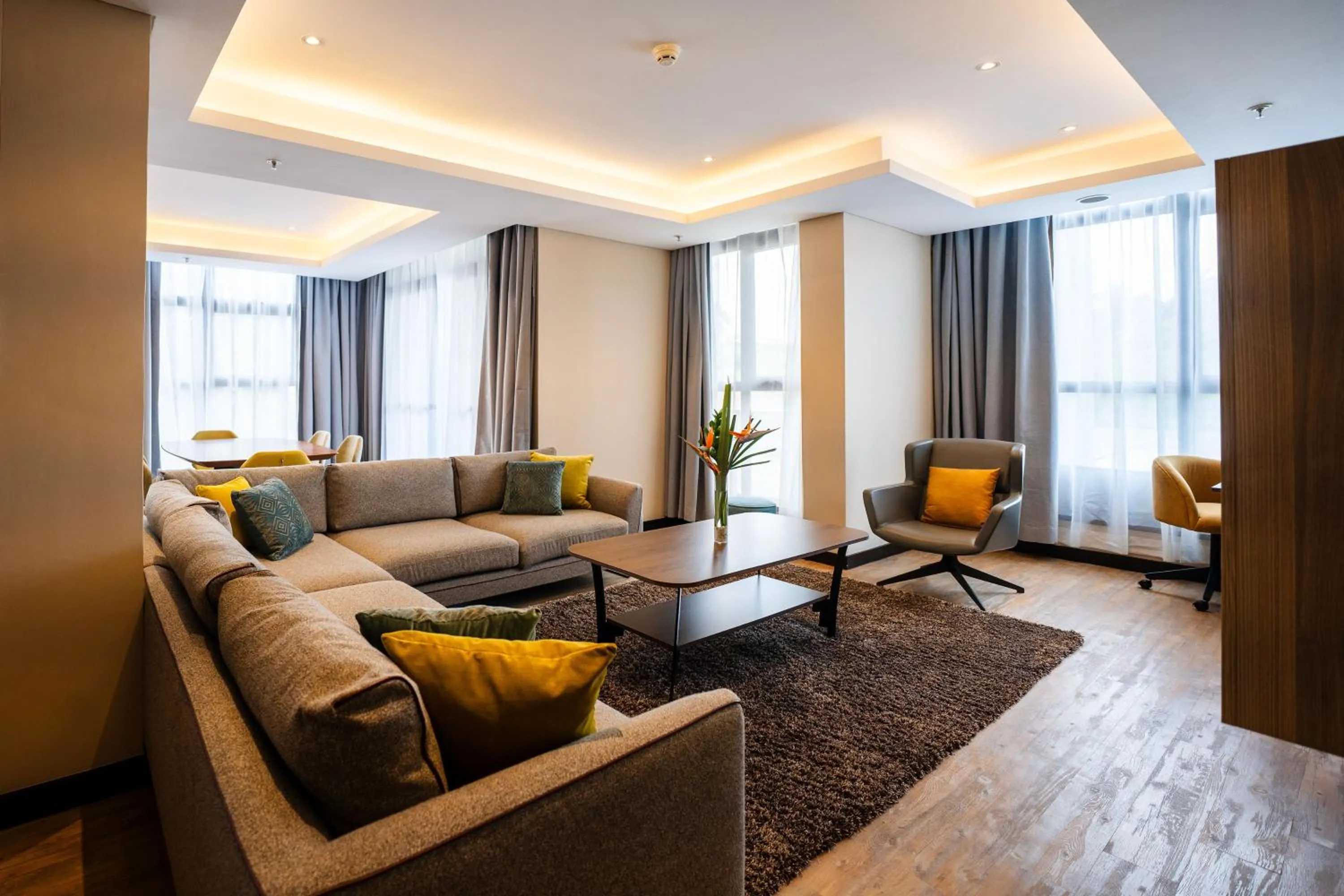 Living room in Trademark Suites at Enaki Town