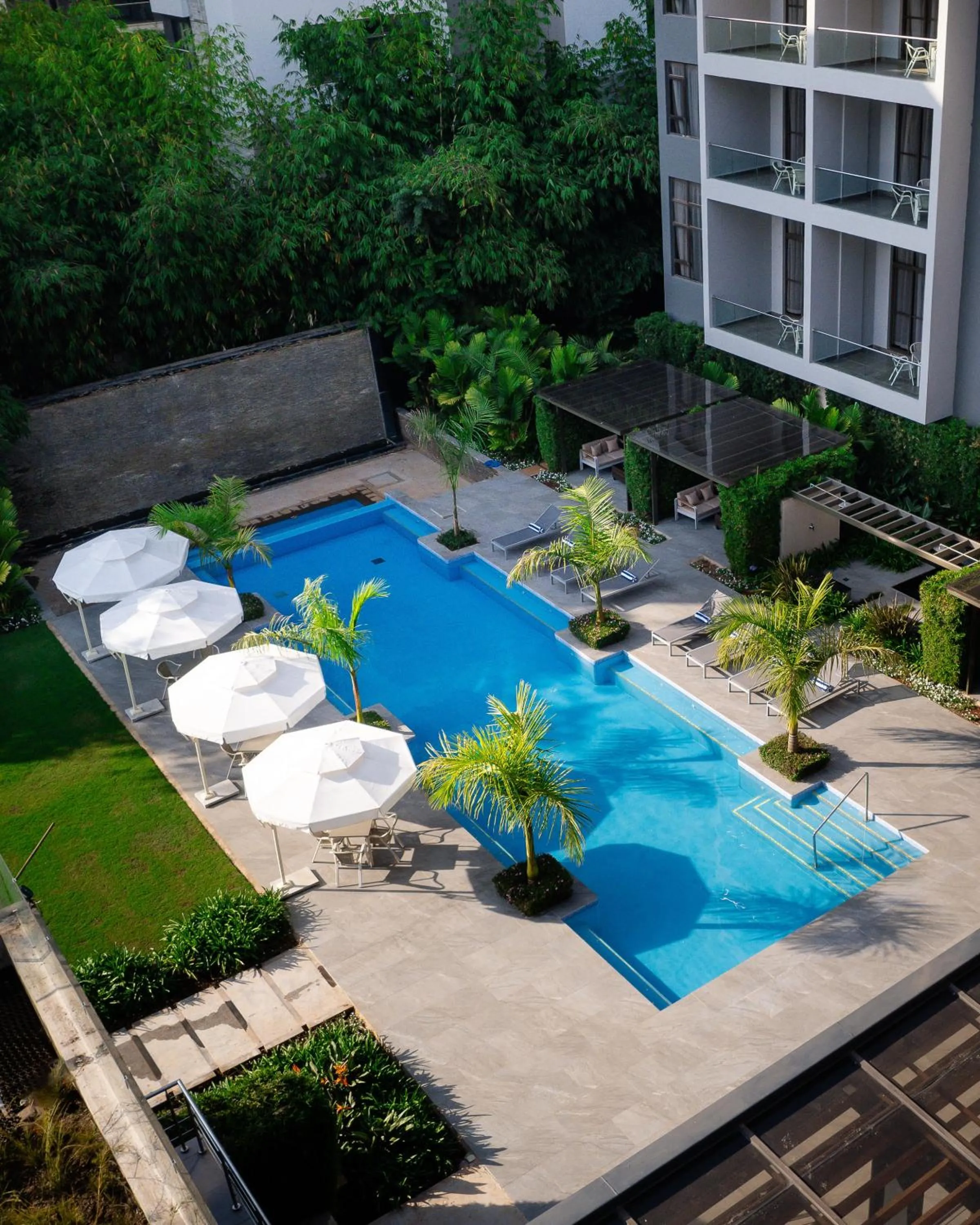 Swimming pool in Trademark Suites at Enaki Town
