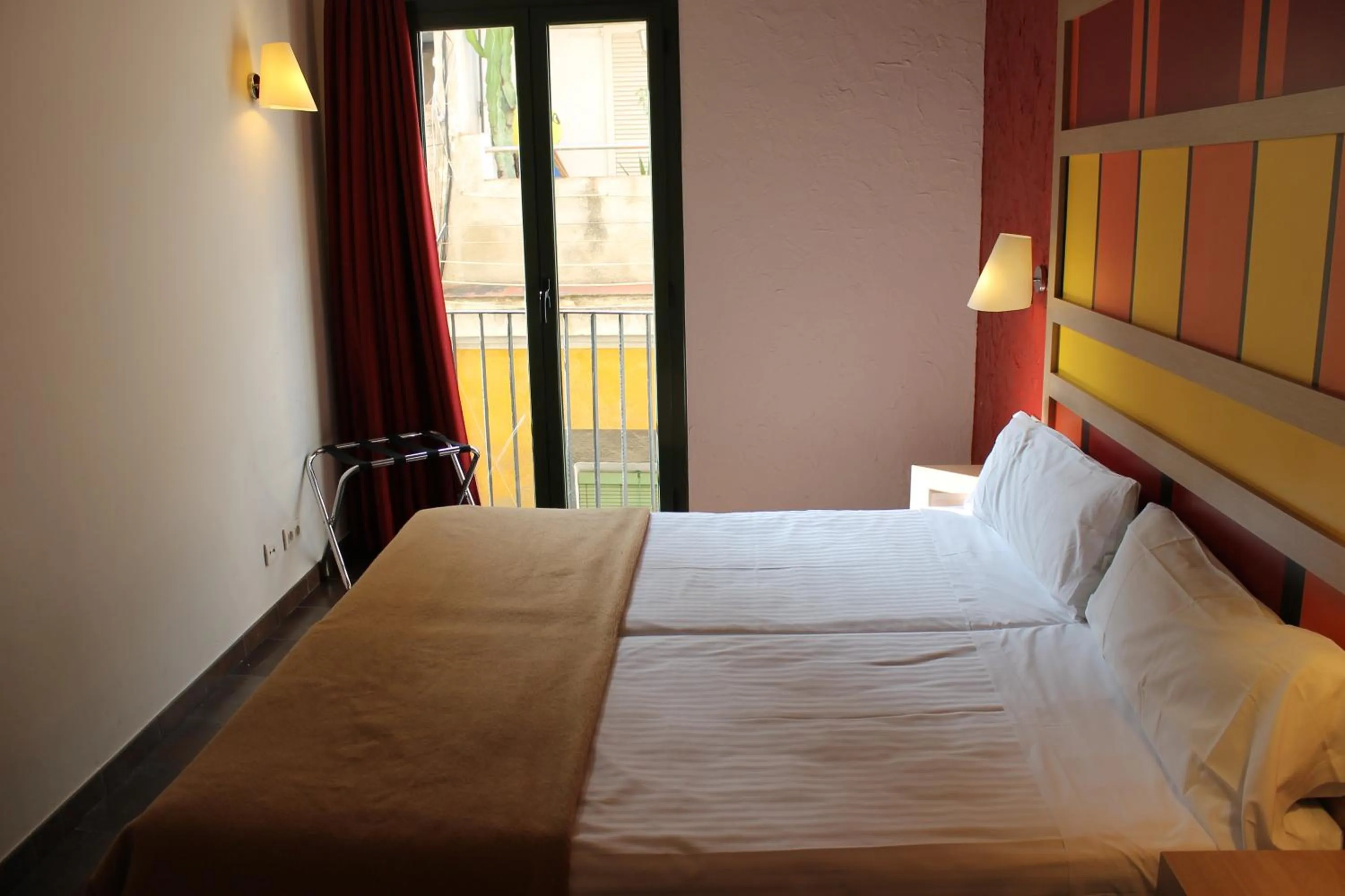 Bedroom, Bed in Apartaments Ciutat Vella