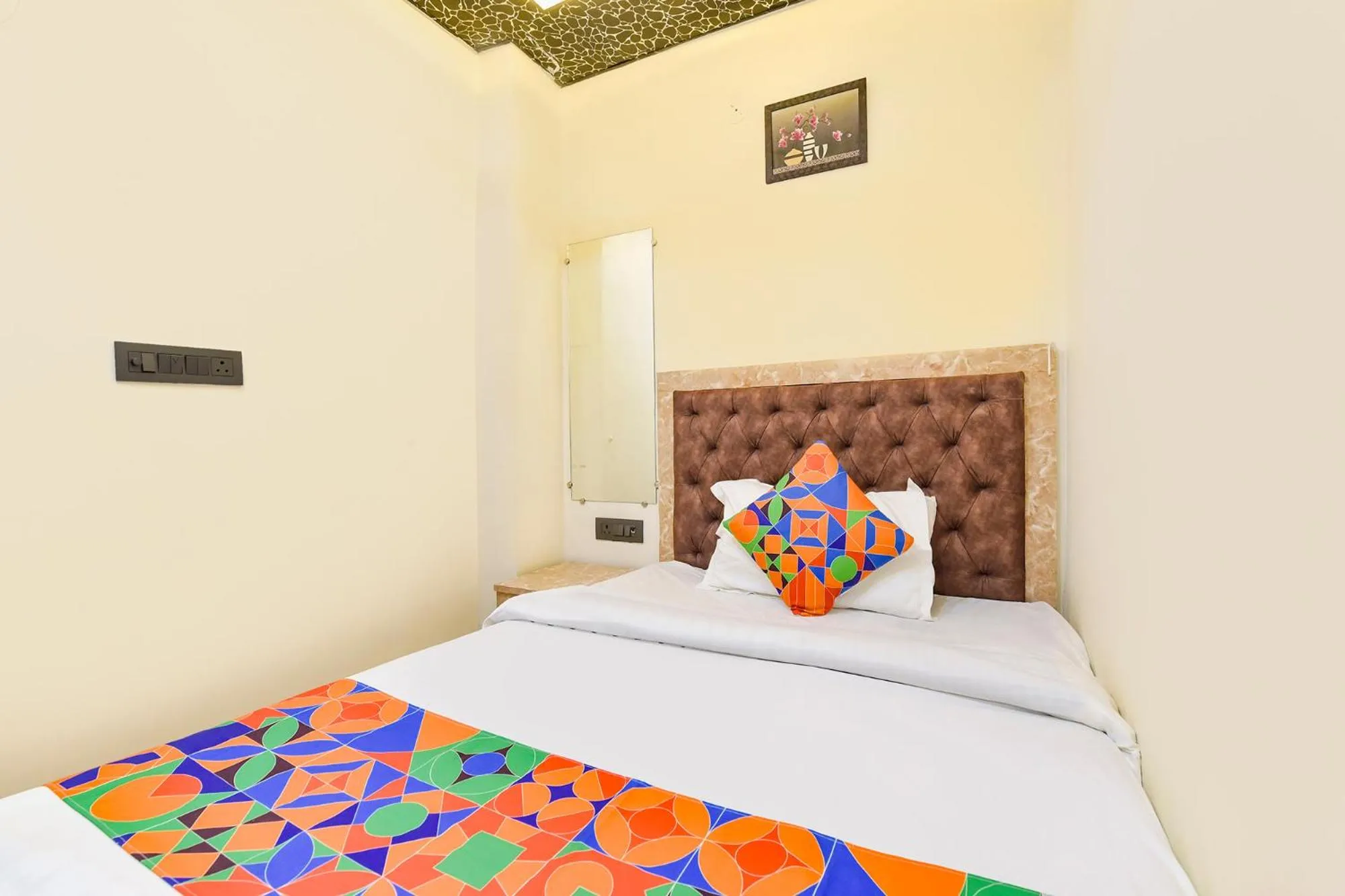 Bed in FabHotel Govindam Royal Stay