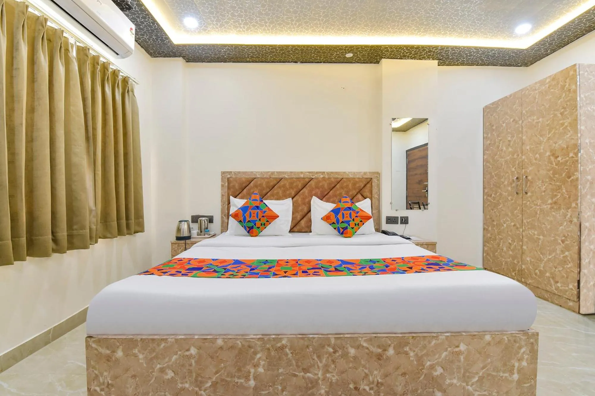 Bed in FabHotel Govindam Royal Stay